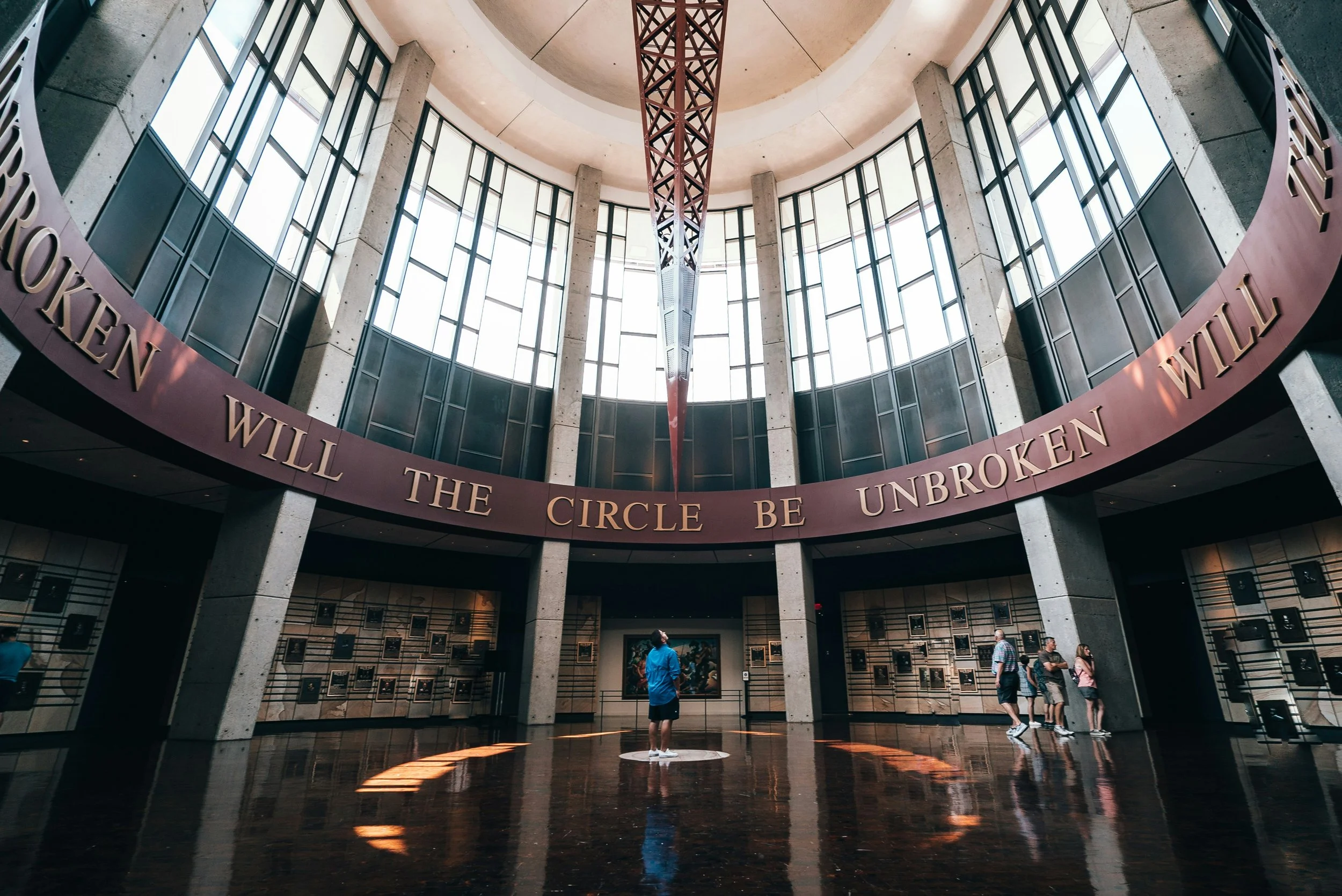 A man looks up in the Country Music Hall of Fame at words that read: Will the circle be unbroken? Drives & Detours Downtown Nashville walking tour