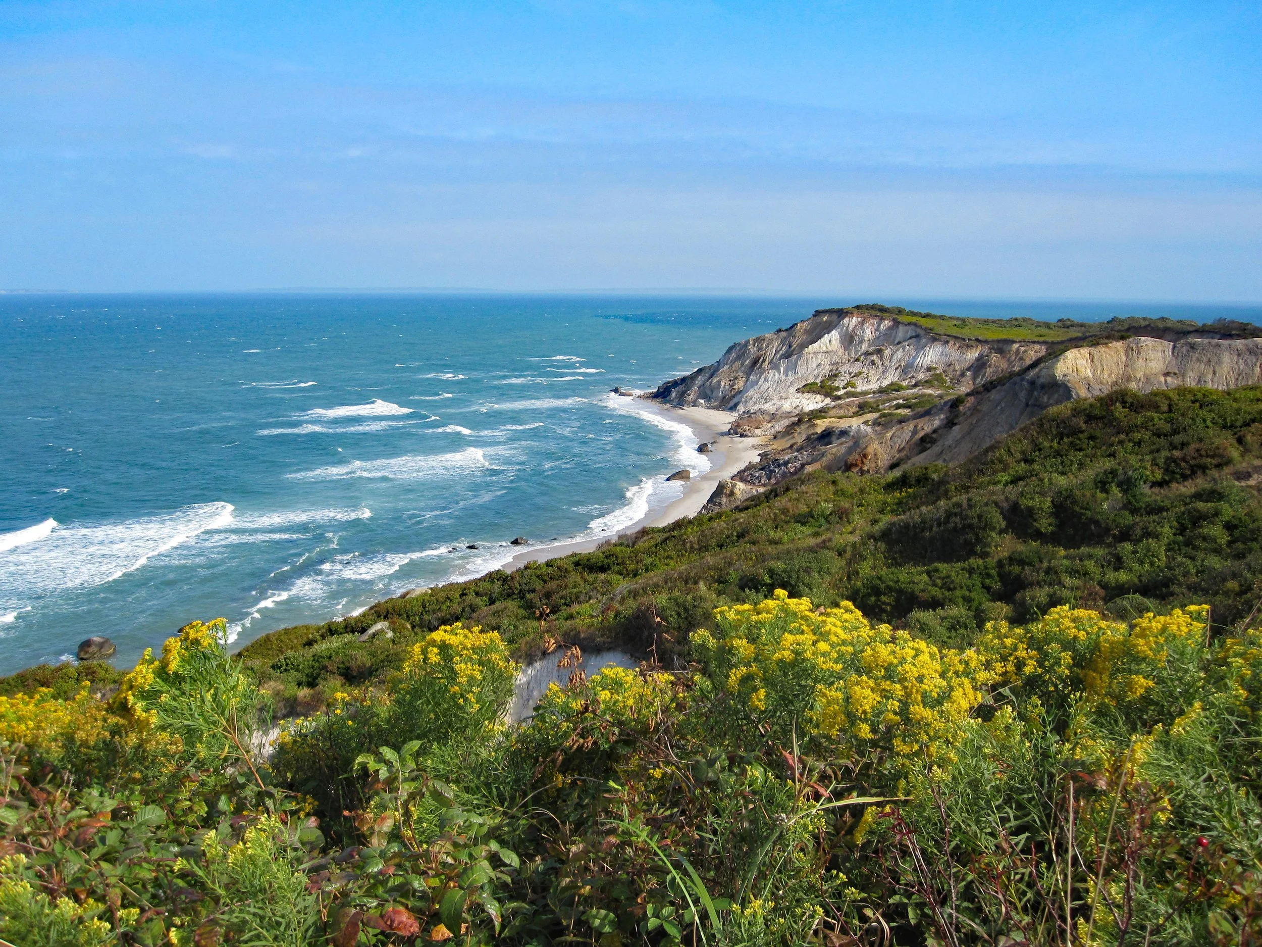 The Aquinnah Cliffs stretch down to the ocean on a bright day. Drives & Detours Top sights in Martha's Vineyard