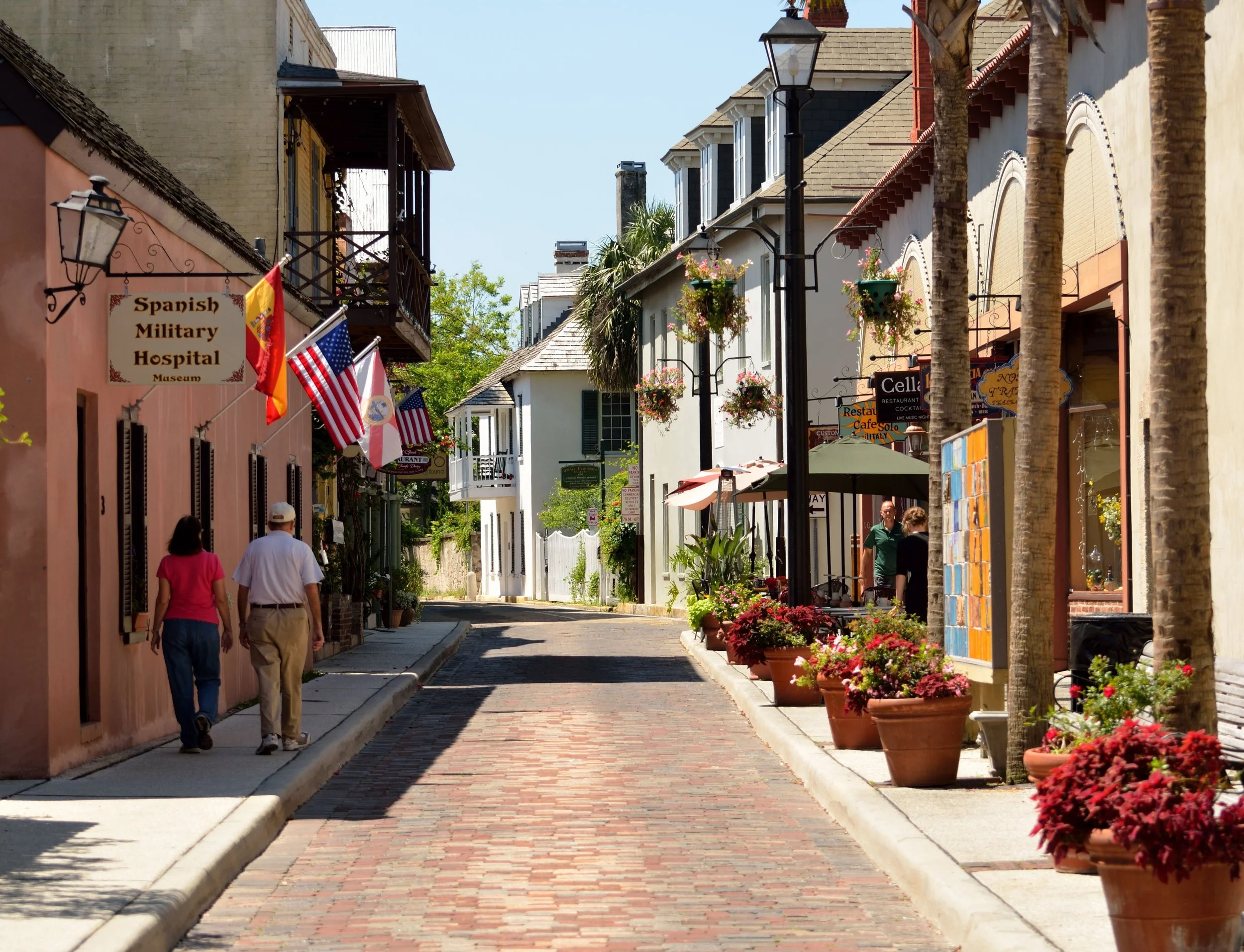 Two people walk along an old brick street in St. Augustine. Drives & Detours St. Augustine local tips