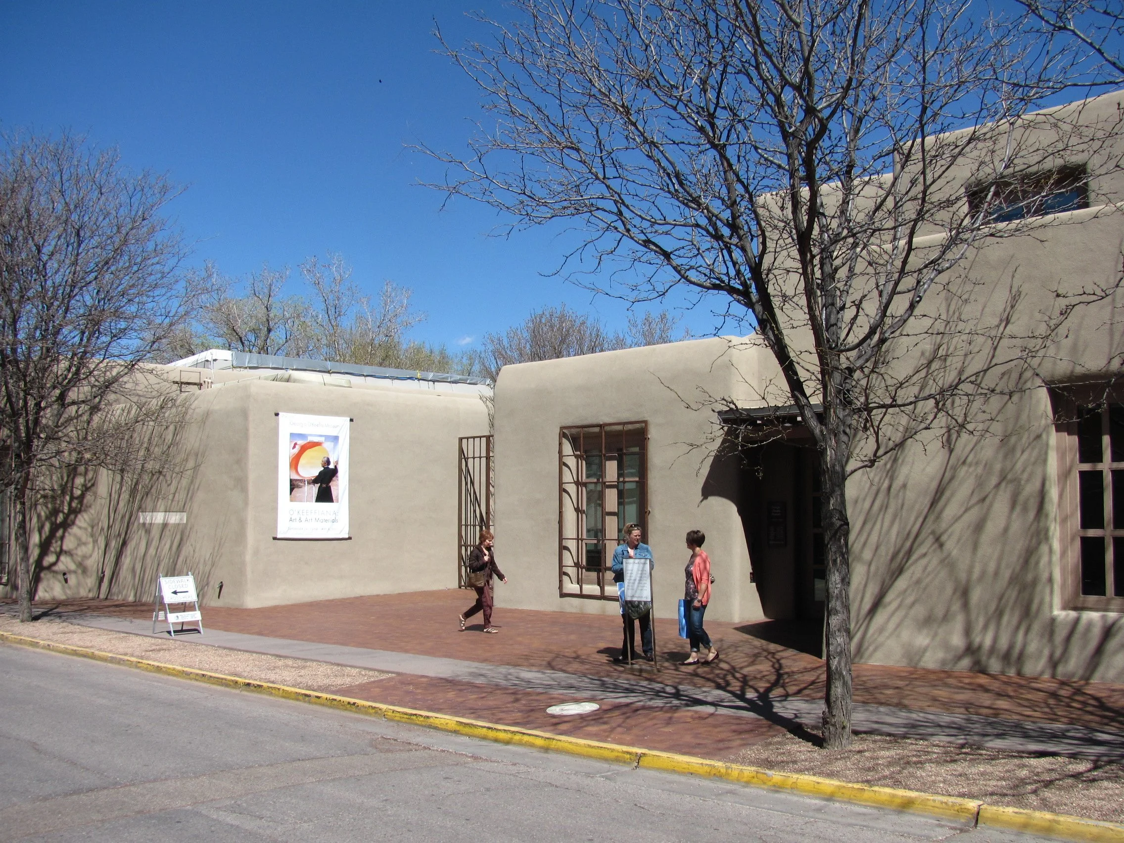 People walk outside the entrance to the Georgia O'Keeffe Museum in New Mexico. Drives & Detours Santa Fe top sights