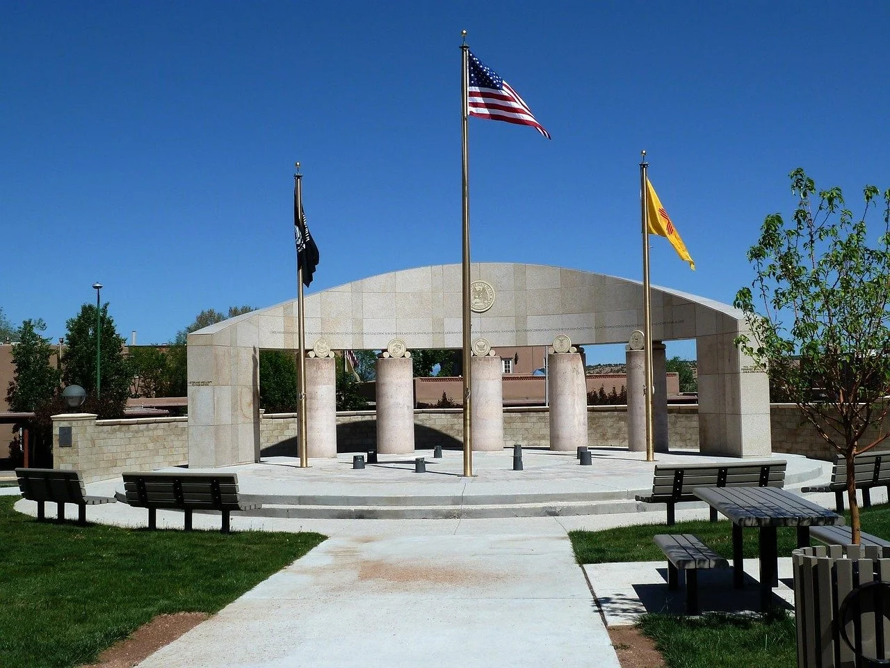 a modern memorial in New Mexico with the American flag flying. Drives & Detours first-timers guide Santa Fe