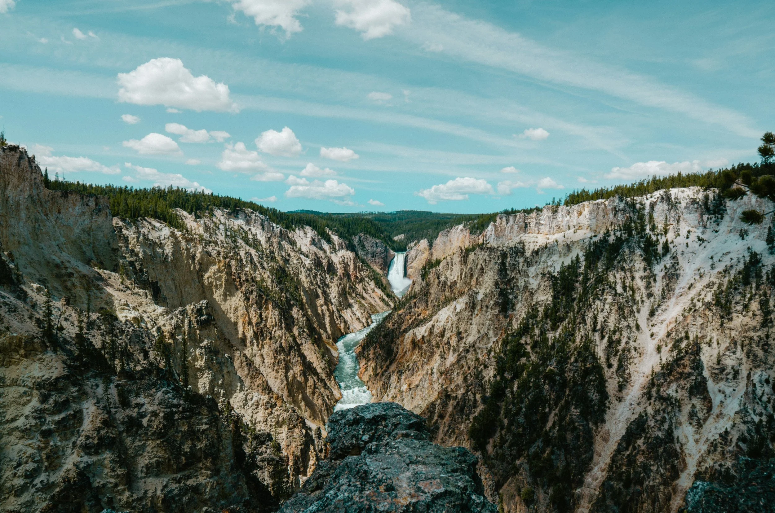A river plunges through the steep Grand Canyon in Wyoming. Drives & Detours Yellowstone driving tour