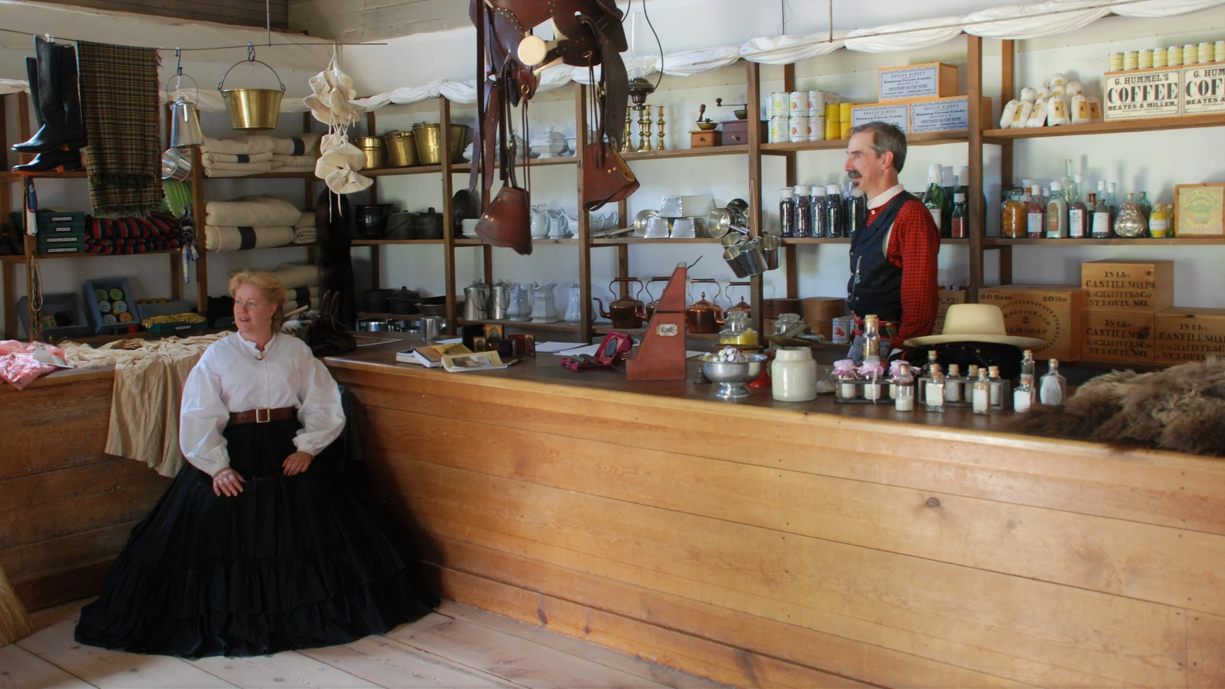 Shopkeepers in an 18th-century trading post at Fort Laramie, Wyoming