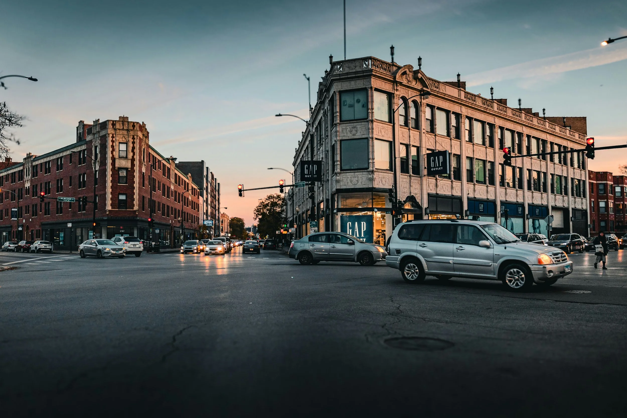 Cars drive through Logan Square at sunset. Drives & Detours best places to eat in Chicago
