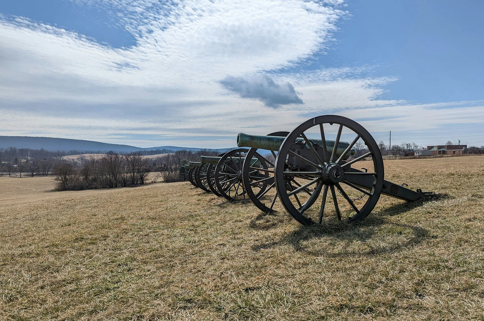 A row of cannon in a civil war battlefield. Drives & Detours Harpers Ferry self-guided tour