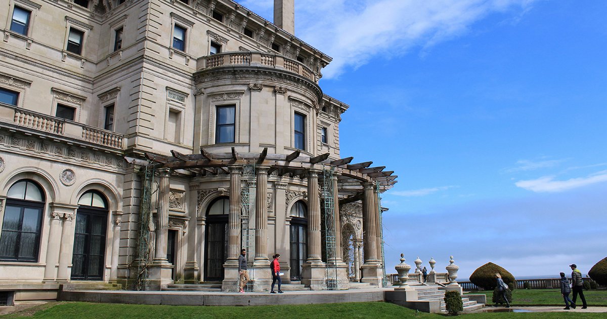 People walk past the Breakers in Newport, Rhode Island