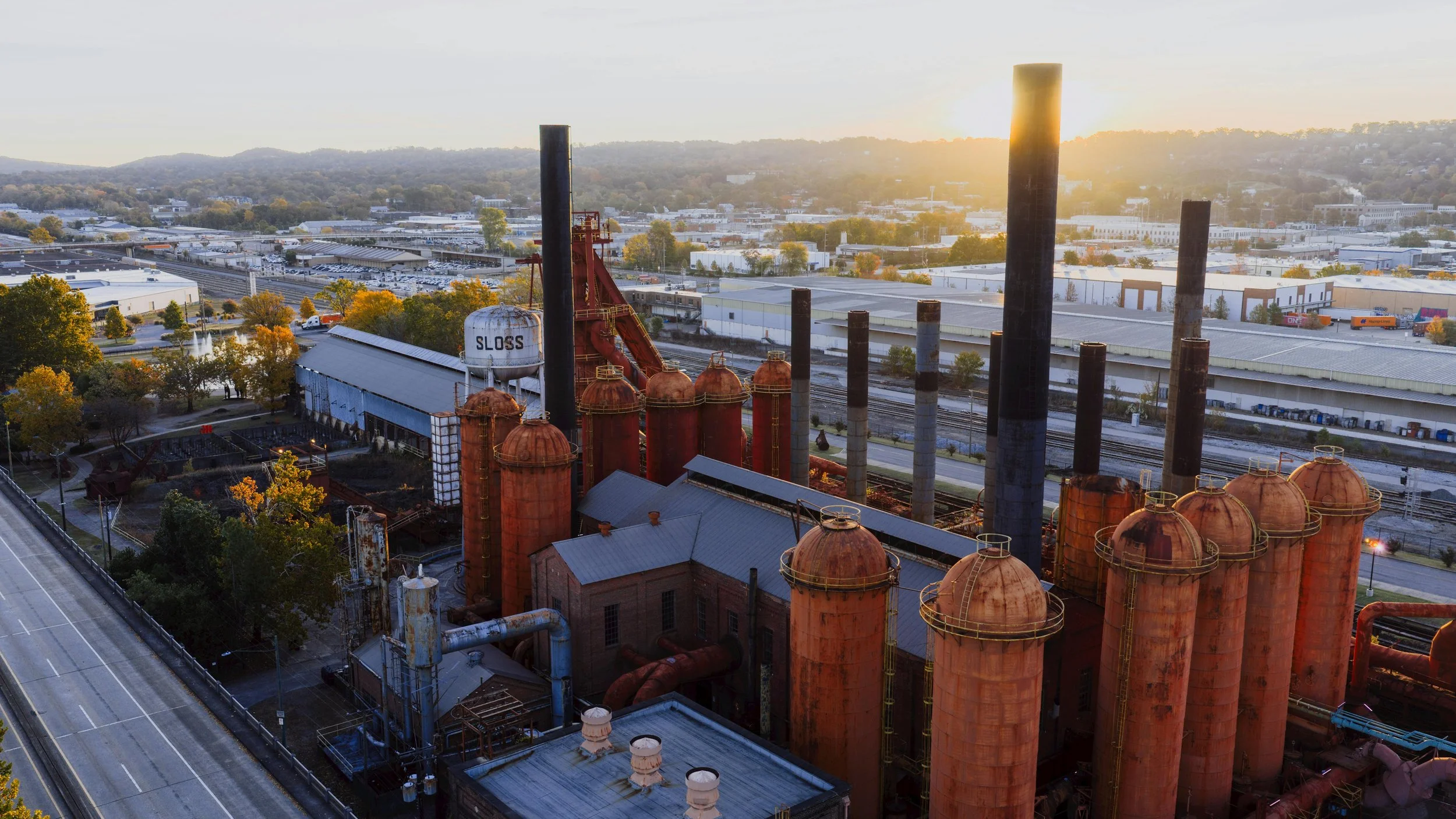 The sun sets behind the Sloss Furnaces National Historic Landmark in Birmingham, Alabama.