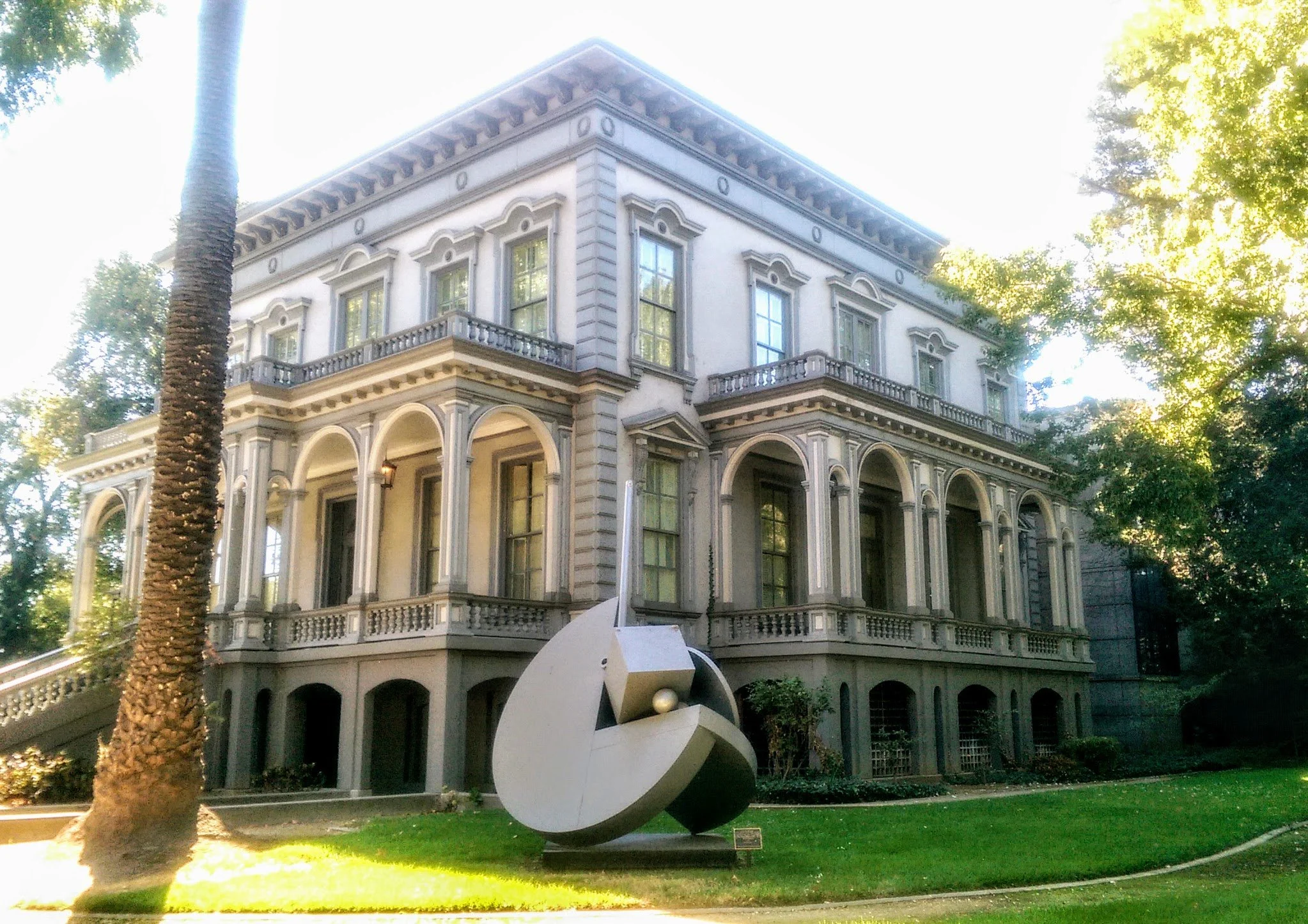 A piece of angular contemporary art sits outside a 18th-century two-storey building at Crocker Art Museum. Drives & Detours  Sacramento attractions for families