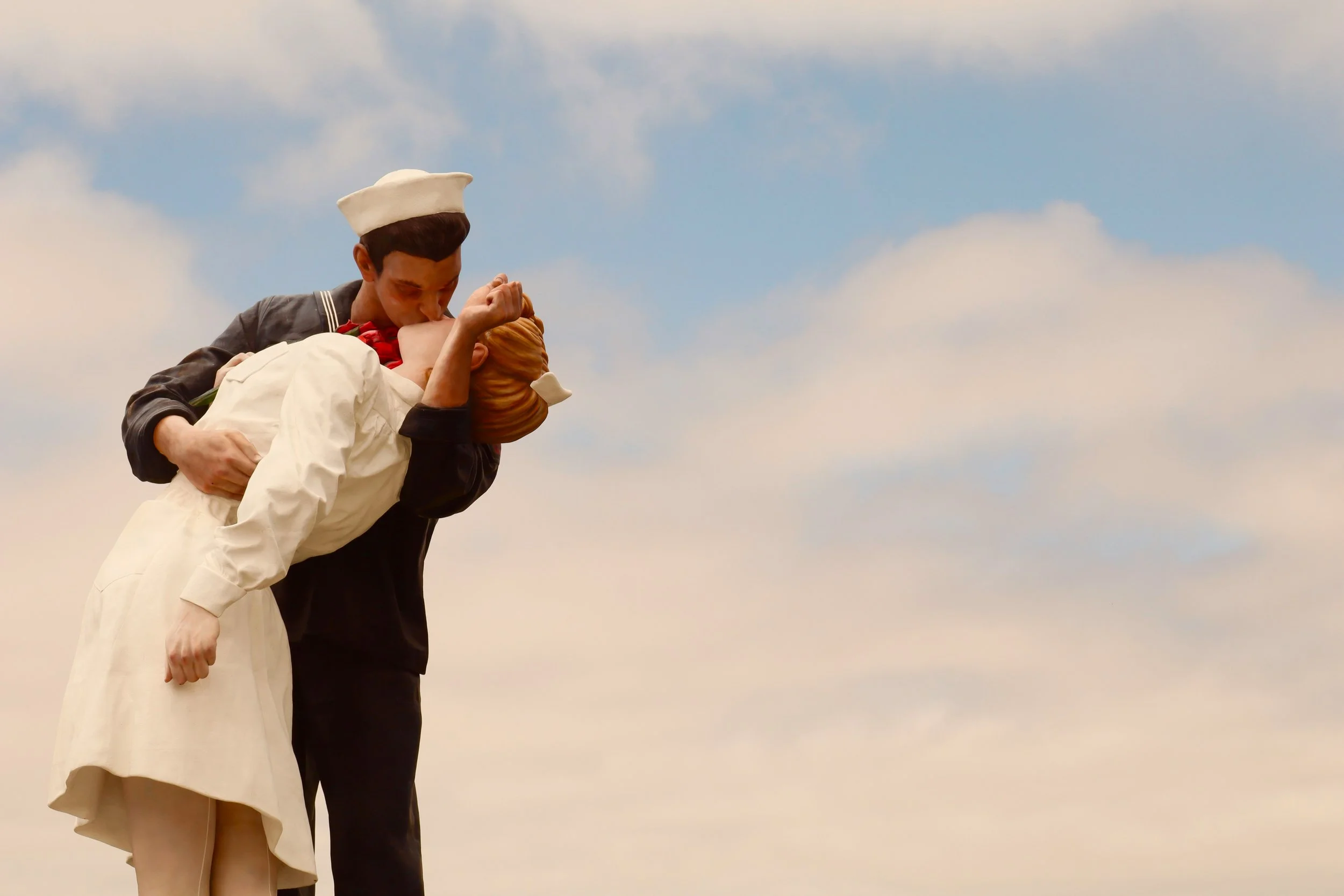 The Embracing Peace Statue (Unconditional Surrender) in San Diego shows a sailor returning from war and kissing a woman. Drives & Detours Things to Do at the San Diego Embarcadero
