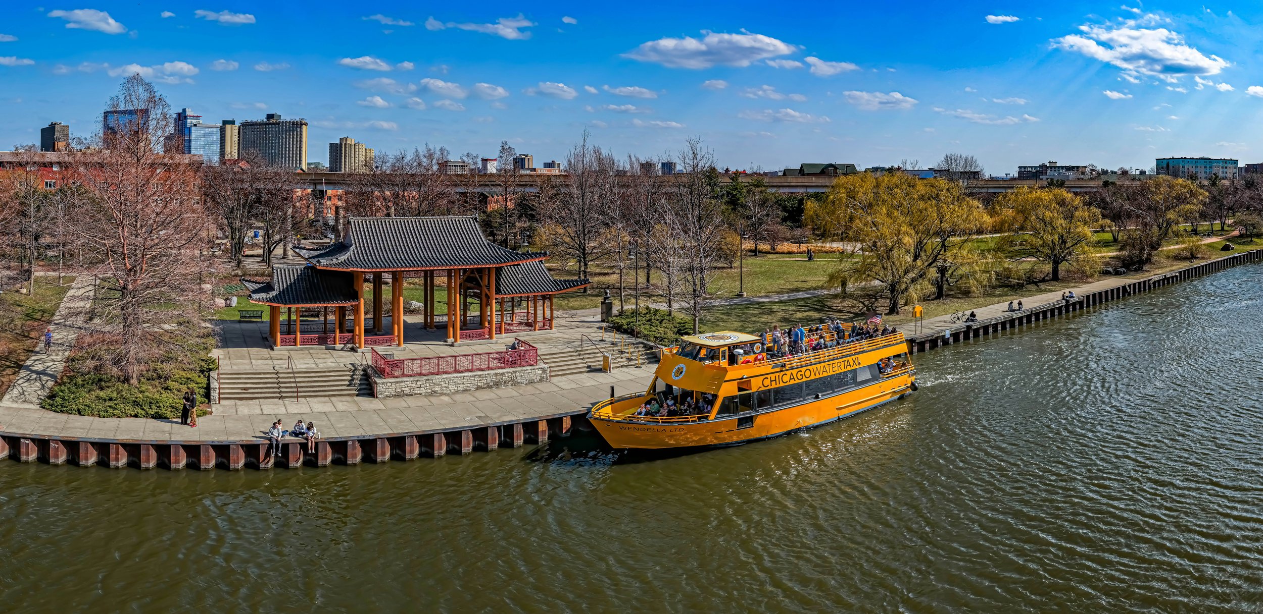 A yellow water taxi docks on a river outside a pagoda in Ping Tom Memorial Park. Drives & Detours Off the beaten path Chicago