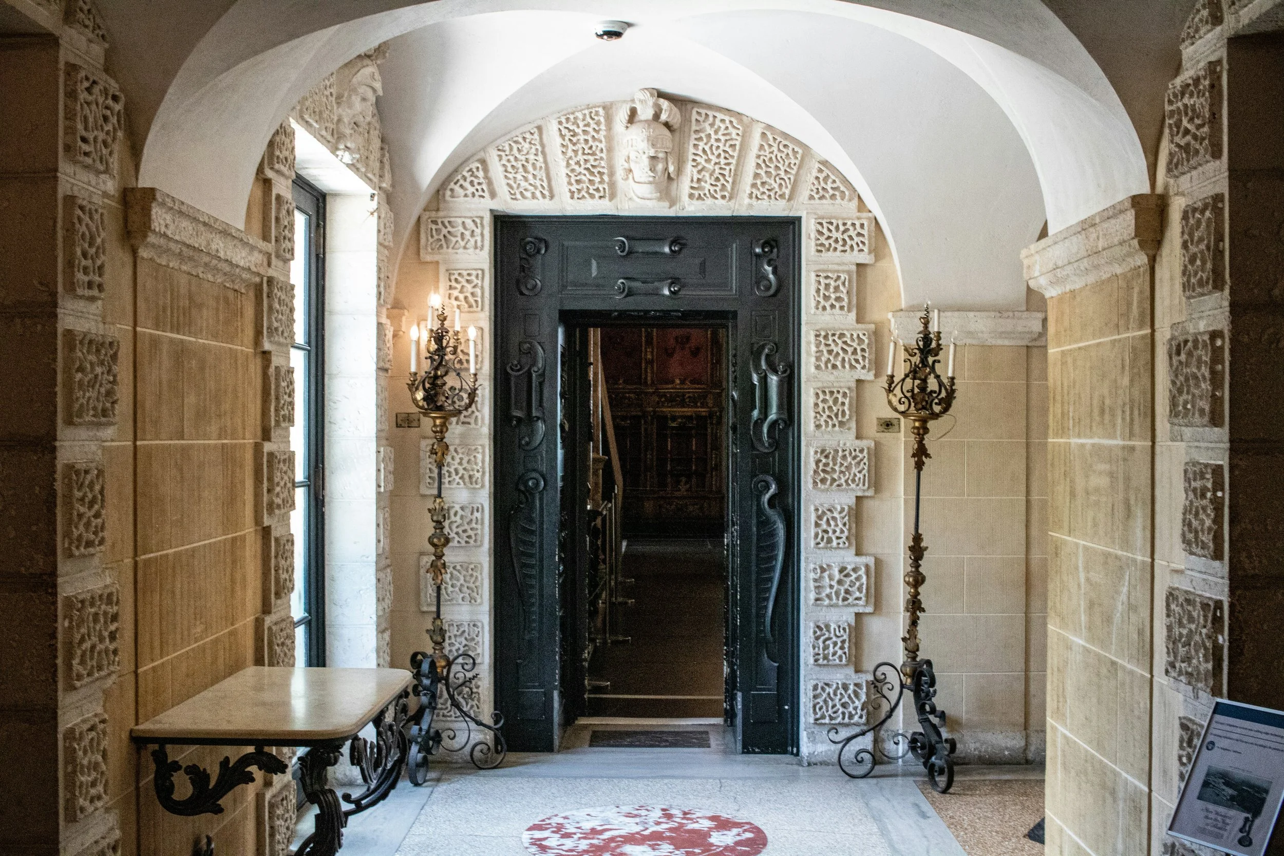 A corridor in the Vizcaya Museum. It could be from a Spanish castle, with an iron door, ornate brickwork and candlesticks. Drives & Detours Top sights in Miami