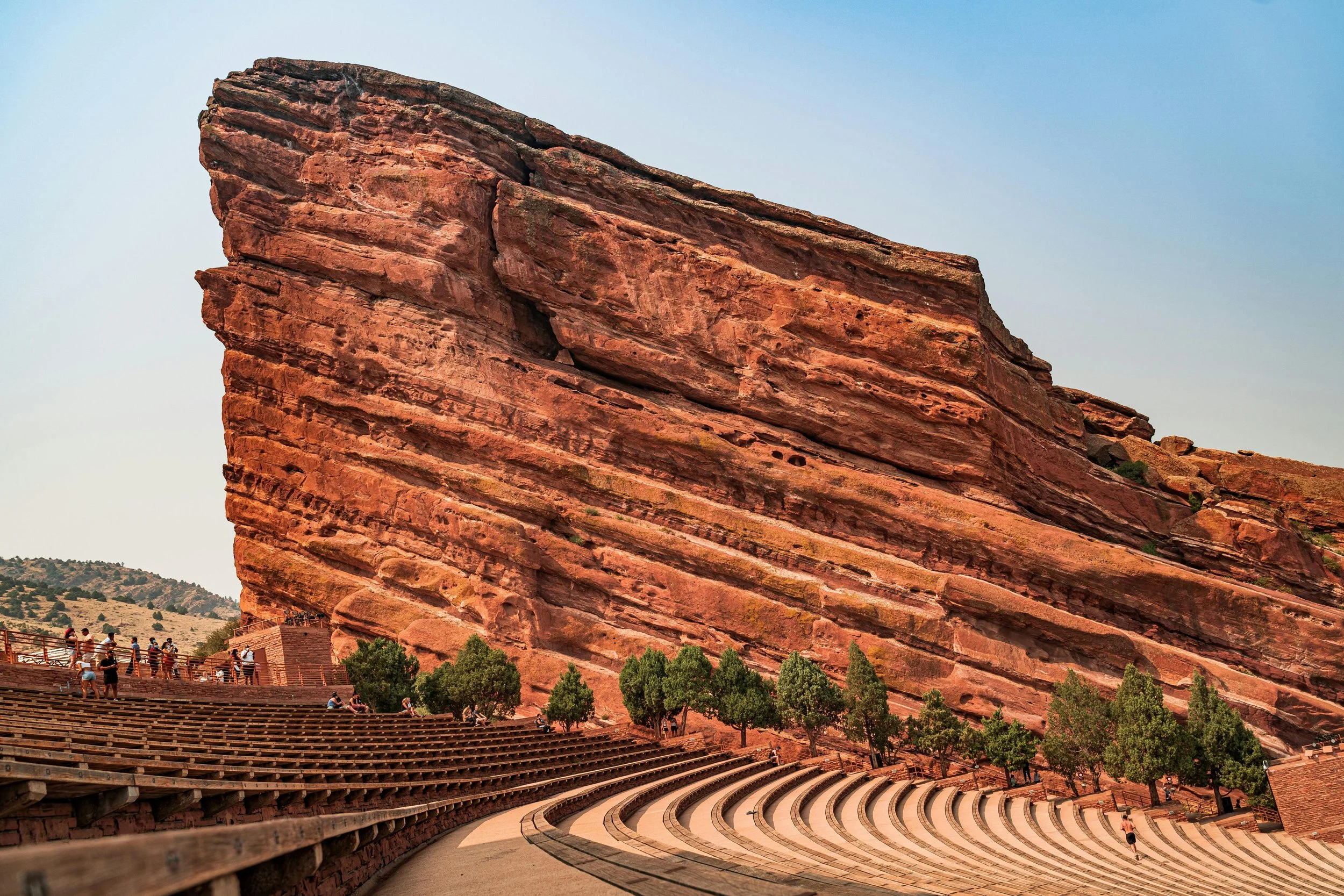 A giant stratified rock formation towers over the seats at Red Rocks Park and Amphitheatre. Drives & Detours Denver top attractions