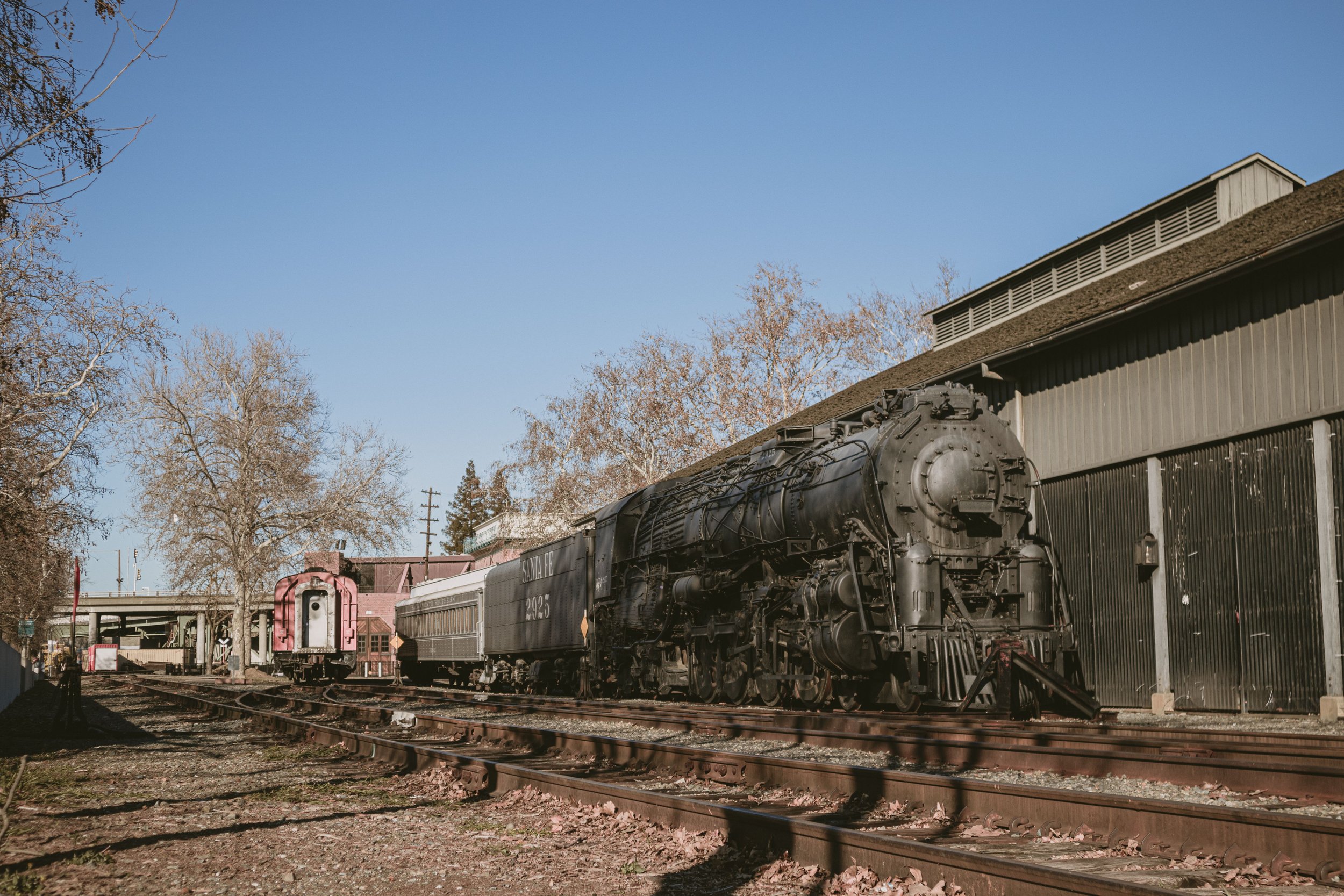 An old steam train with Santa Fe written on its coal bunker sits on tracks at the The California State Railroad Museum. Drives & Detours Top sights in Sacramento