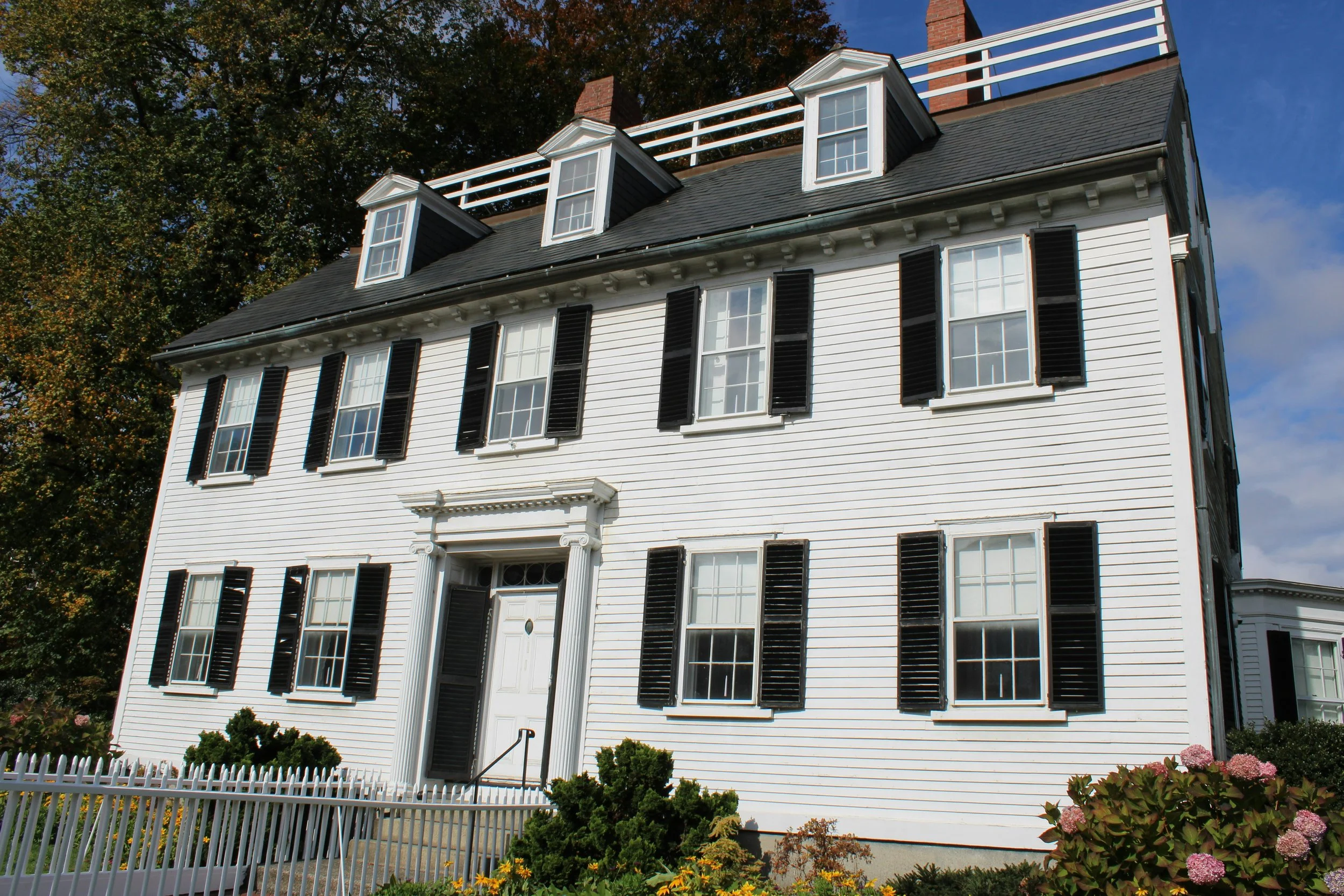 A large, white, wooden house in Salem, Massachusetts. Drives & Detours Salem self-guided tour
