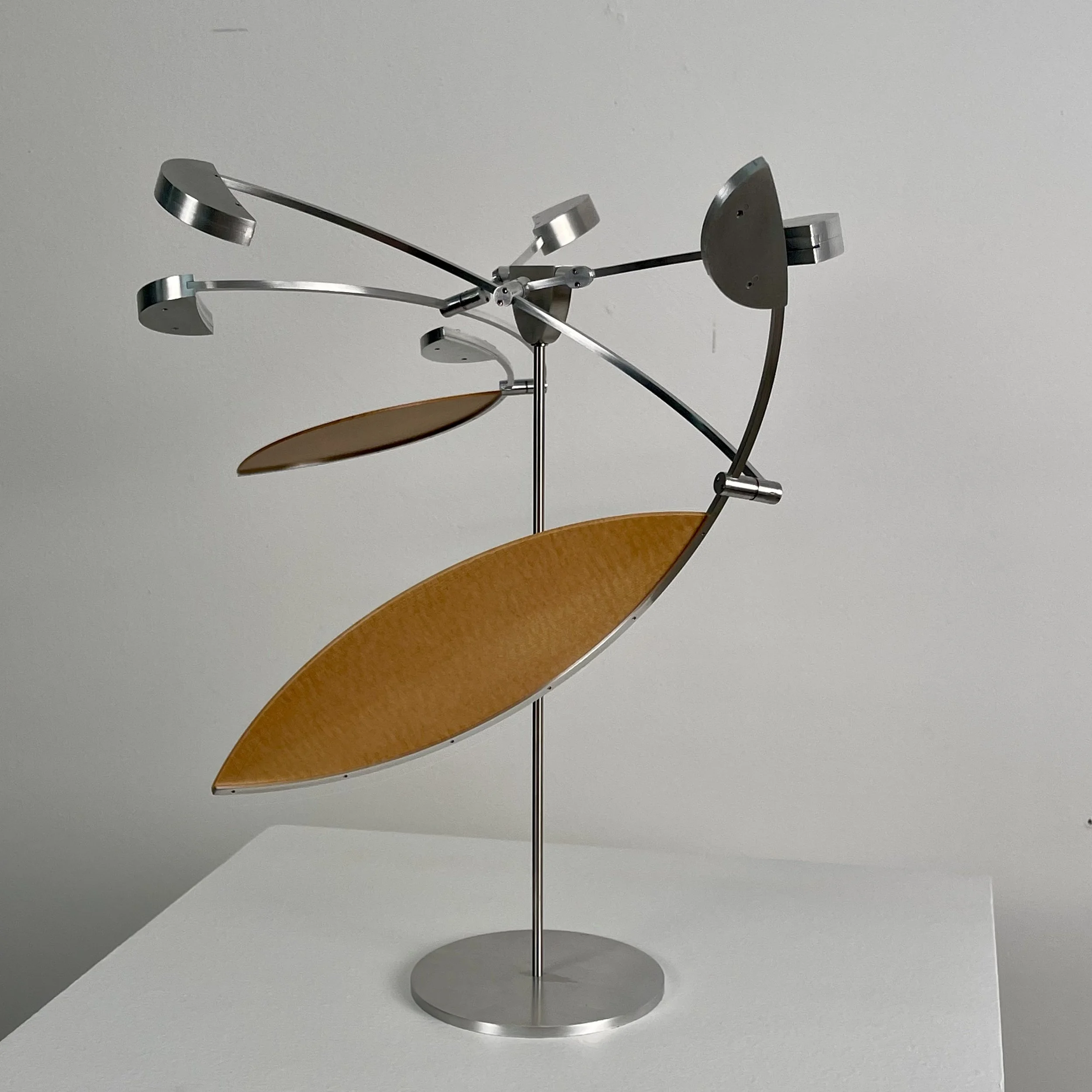 MONARCH
2023   Brushed aluminum, Sitka spruce, stainless steel, brass
Table top.  Base size:  4” dia.
Max height:  23”    Max swing:  28”