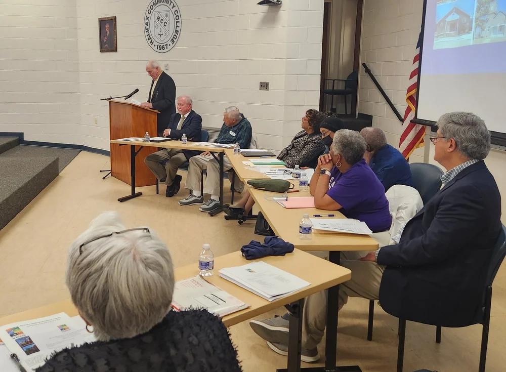 Panelists with George Joyner speaking.JPG