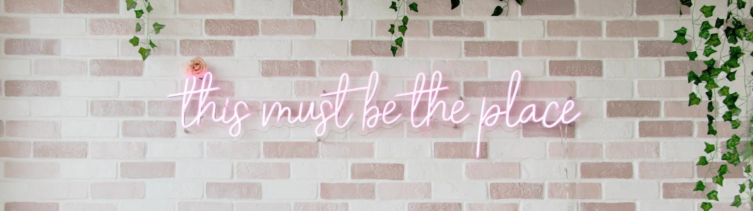 This must be the place neon sign at All That Beauty Bar in Kanata Ottawa