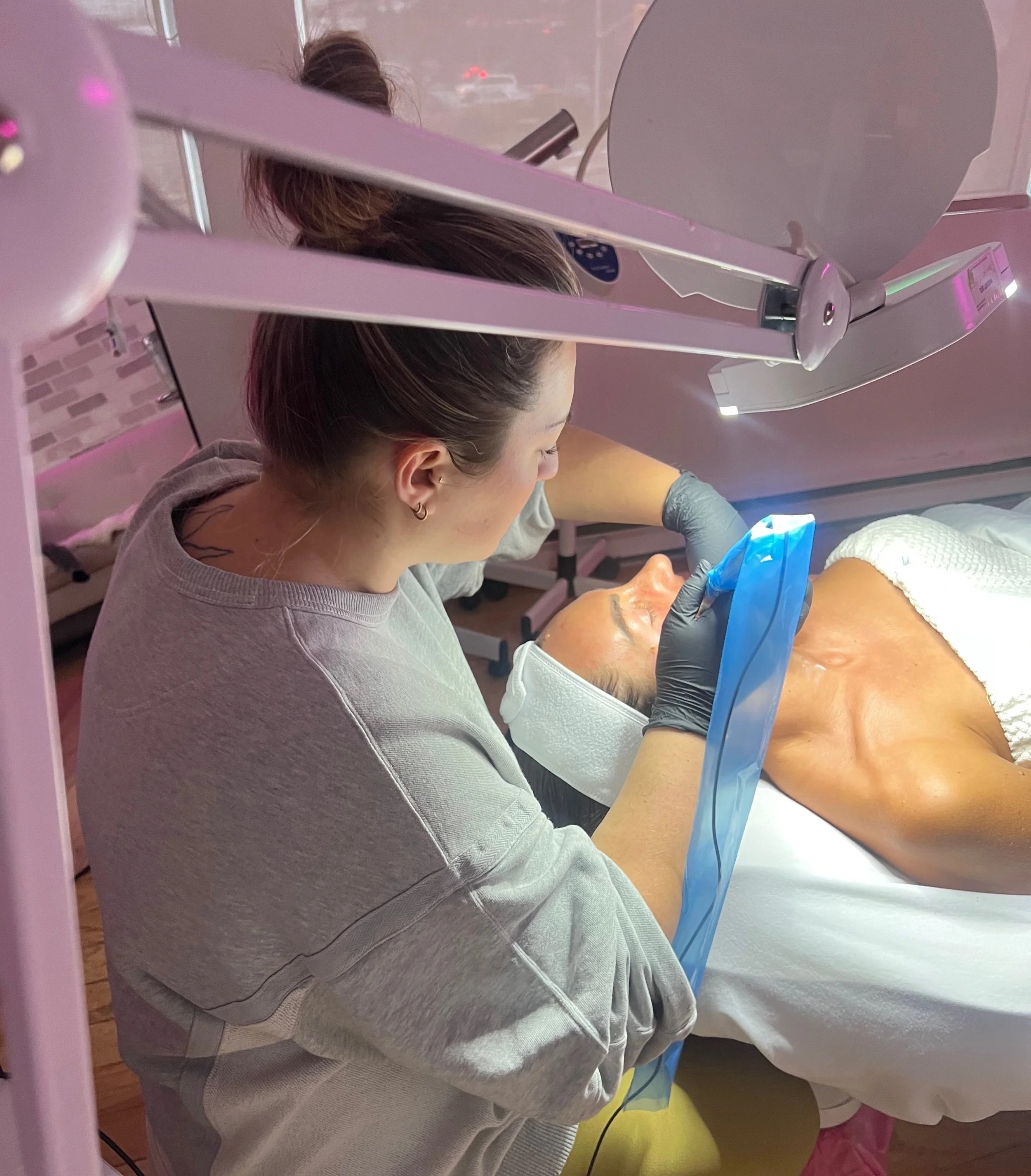 Malia Palmer giving microneedling treatment at All That Beauty Bar