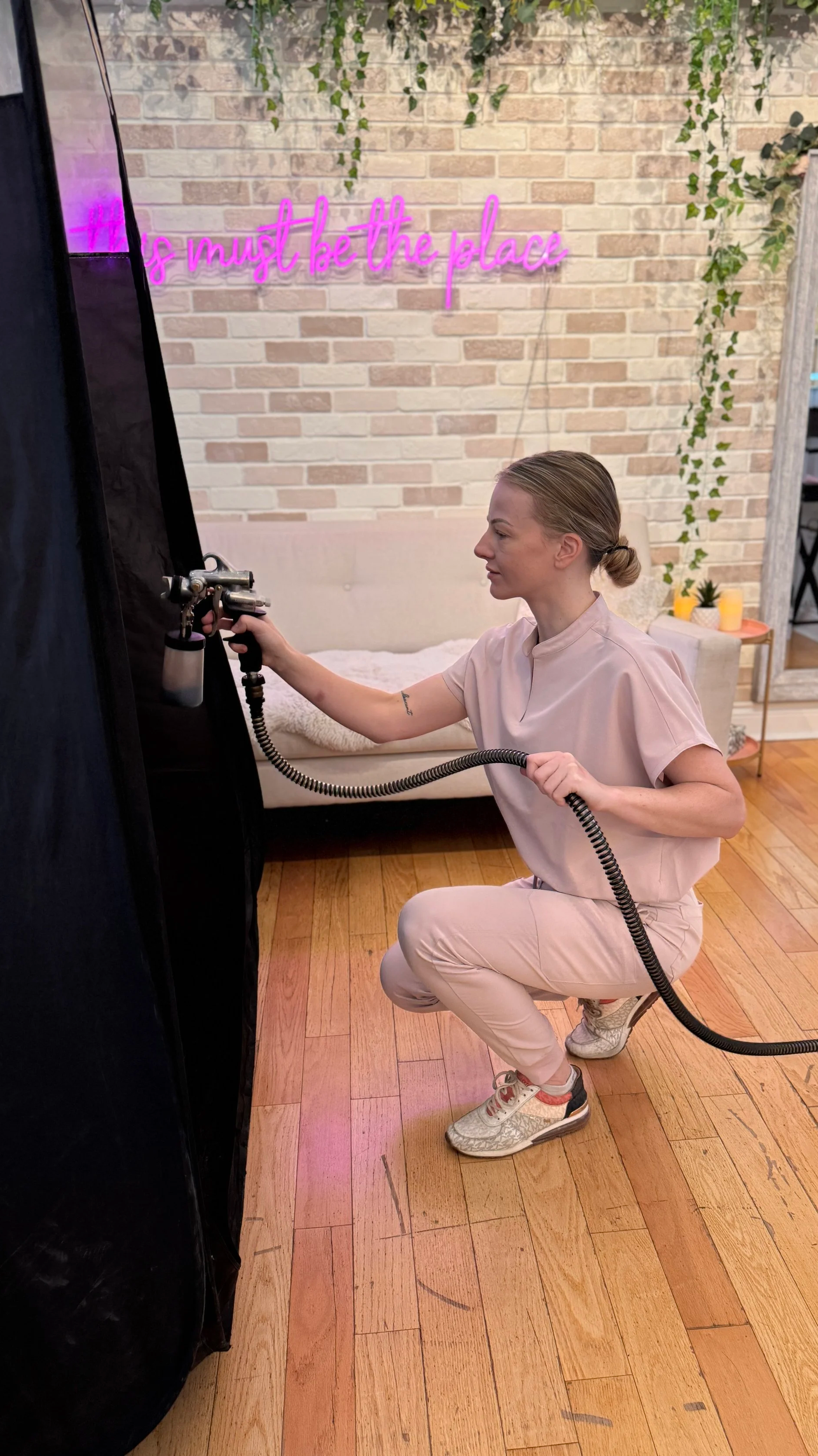 Michaela performing a spray tan in Kanata at All That Beauty Bar