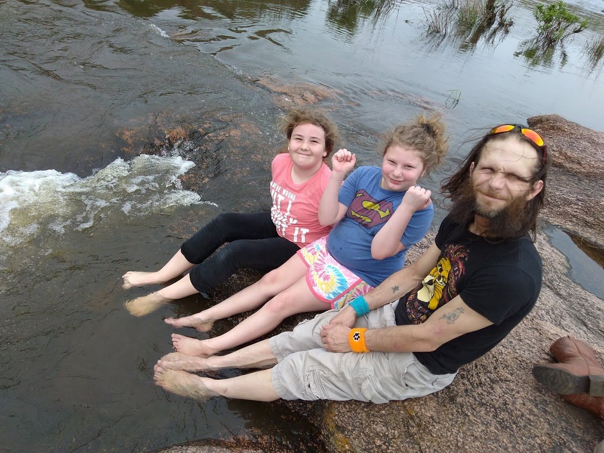 The Blessed Ohana- Justin and the girls playing in the river