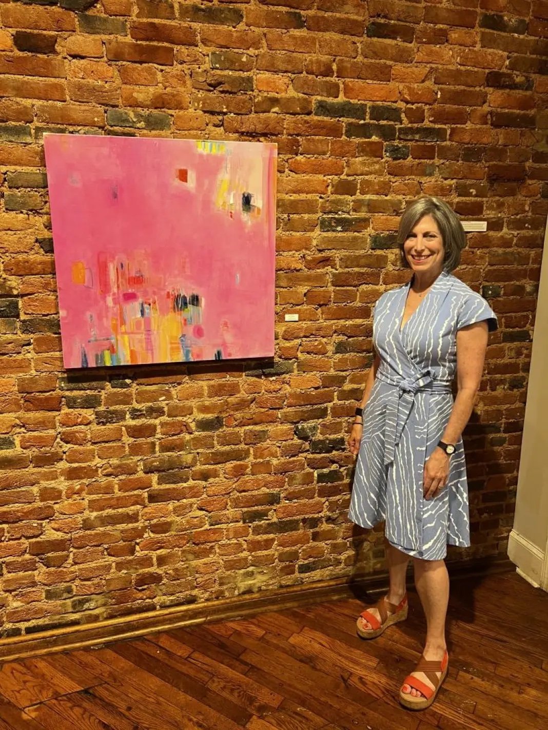   Artist Sally Eisenberg with her painting “A Fresh Start” | Courtesy of Sally Eisenberg  