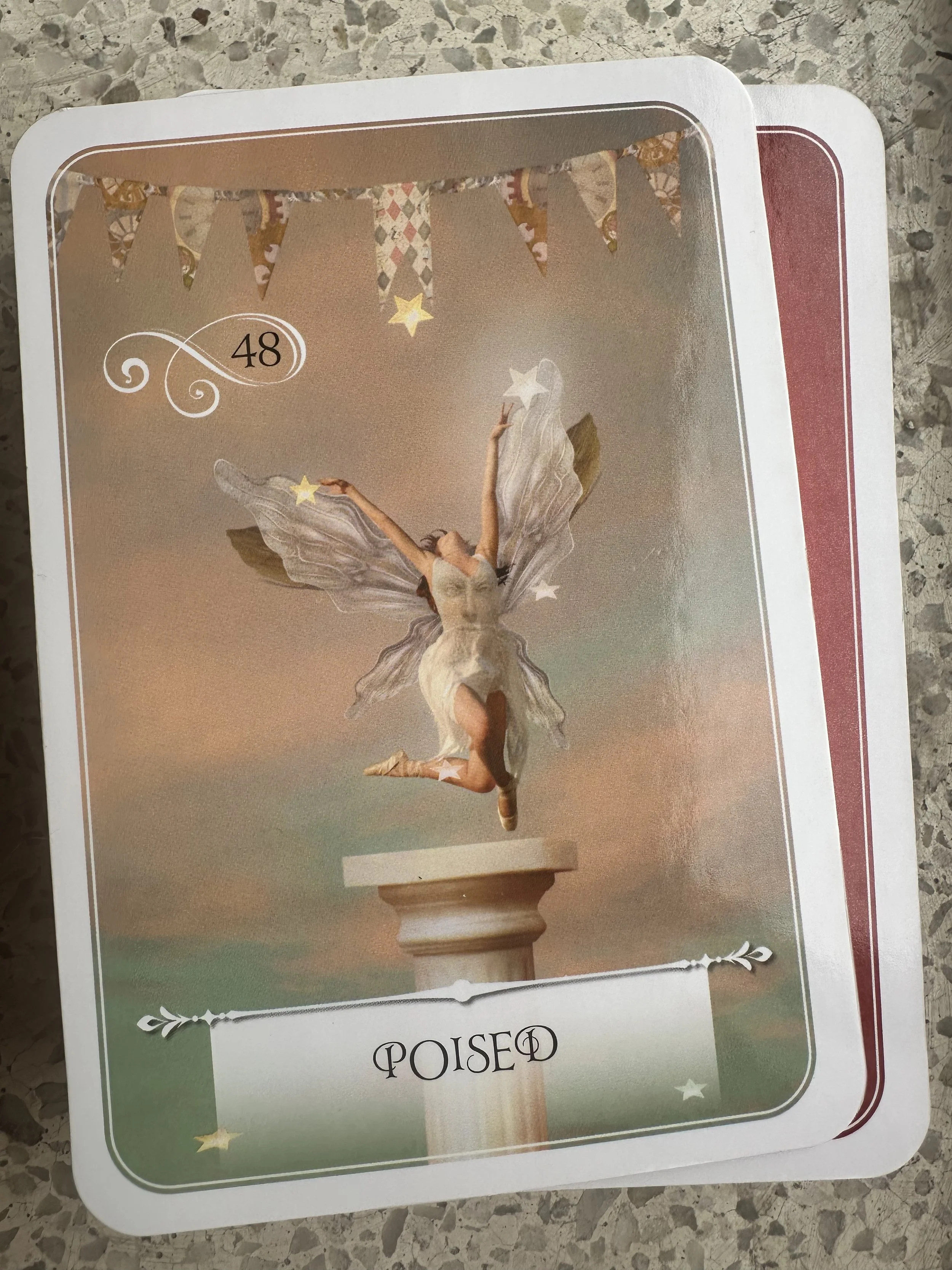 A fantasy-style card showing a fairy with silver wings, jumping in front of a pastel-colored sky, with the word 'POISED' and the number 48 on the card.