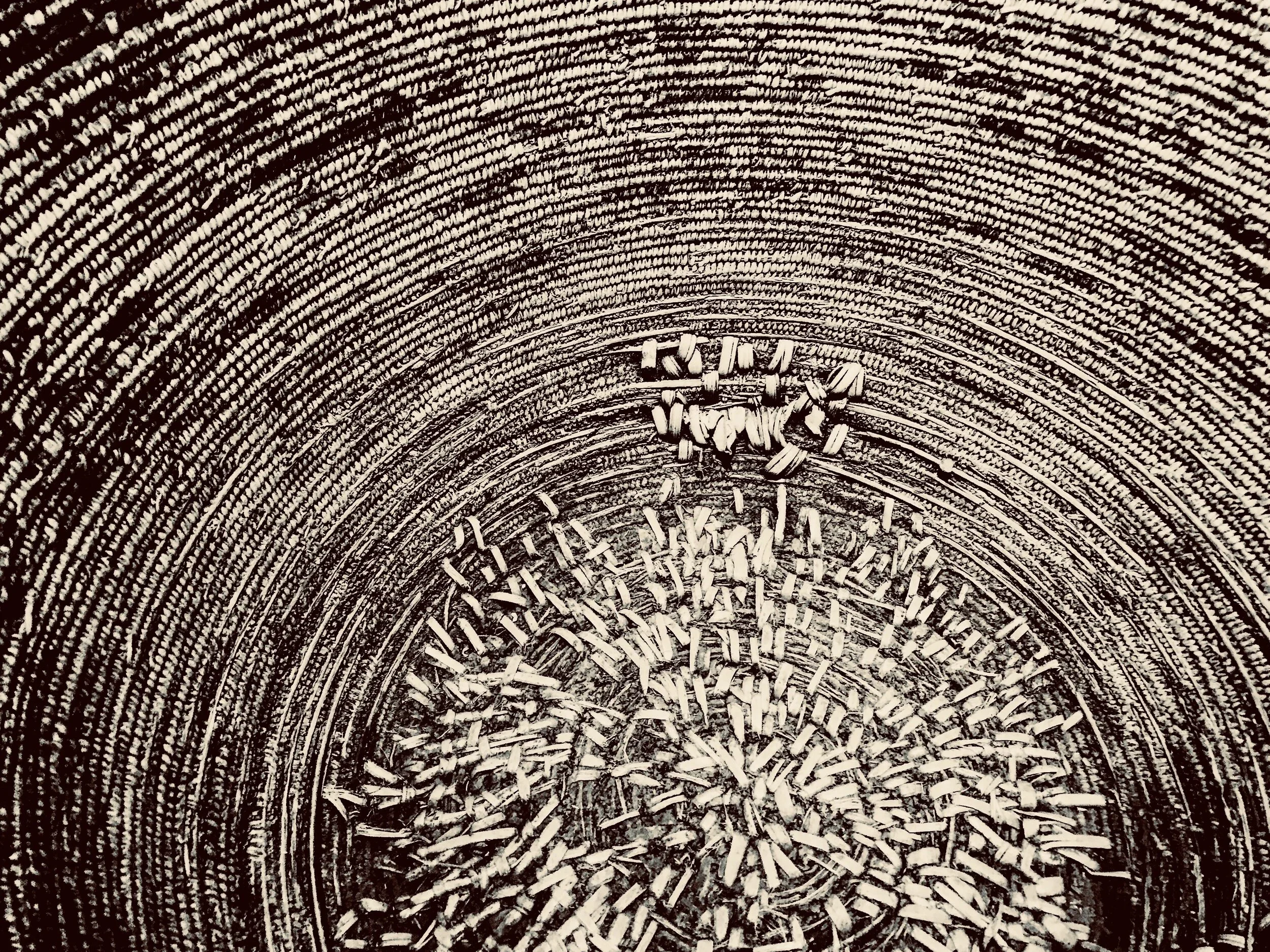 Basket by Lori Lachman. Photographs on Wood
___________________________________________
Heavy acorn mush strains the bottoms of baskets, this is a close up of Nisenan repair on one such basket.