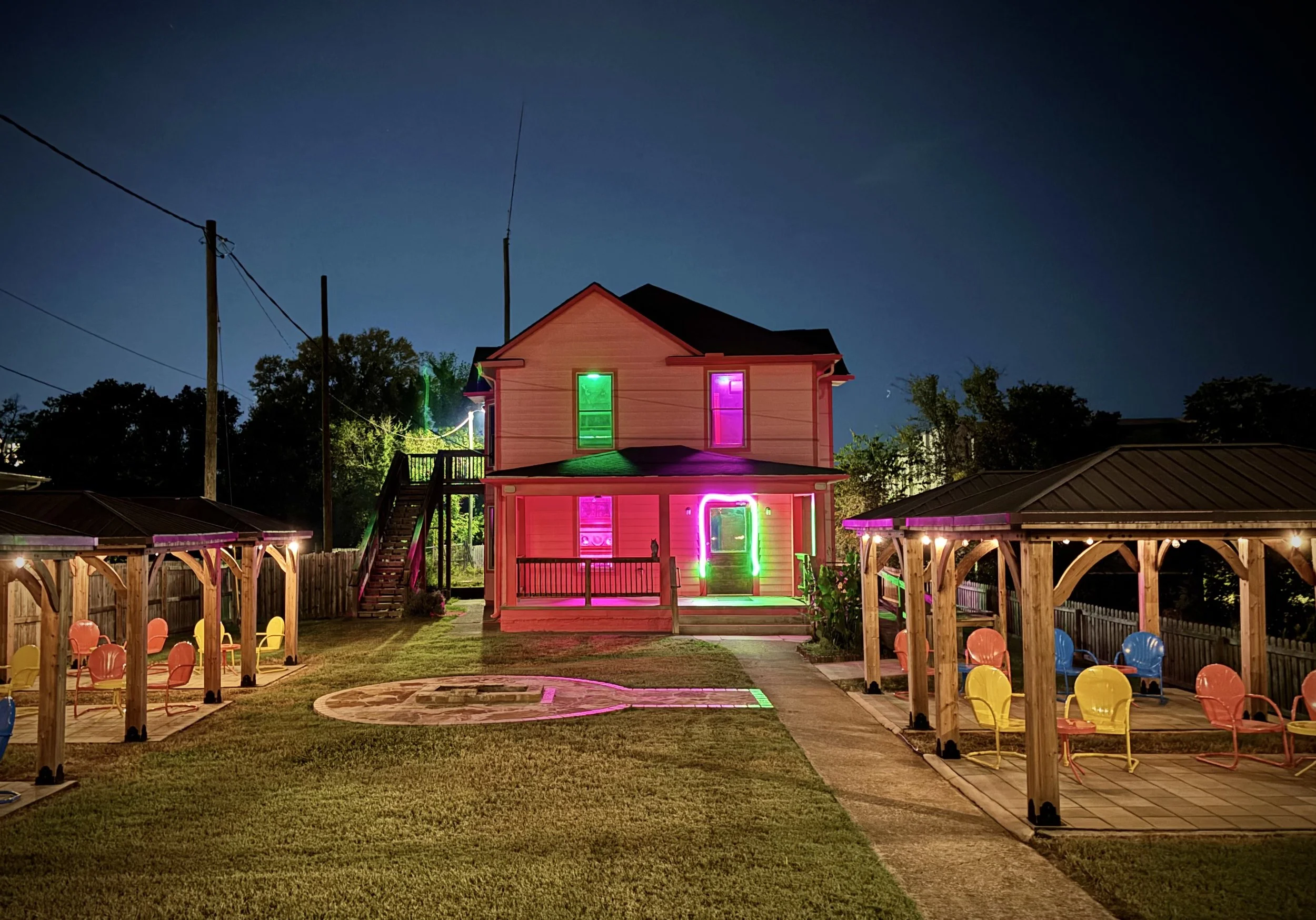 The Pink Cactus glows beneath colorful lights, welcoming the community for karaoke, food, drinks, and unapologetically fun nights.