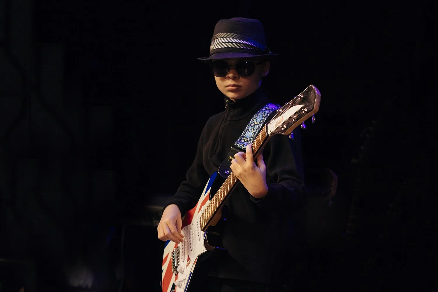 young guitar player sunglases.jpg