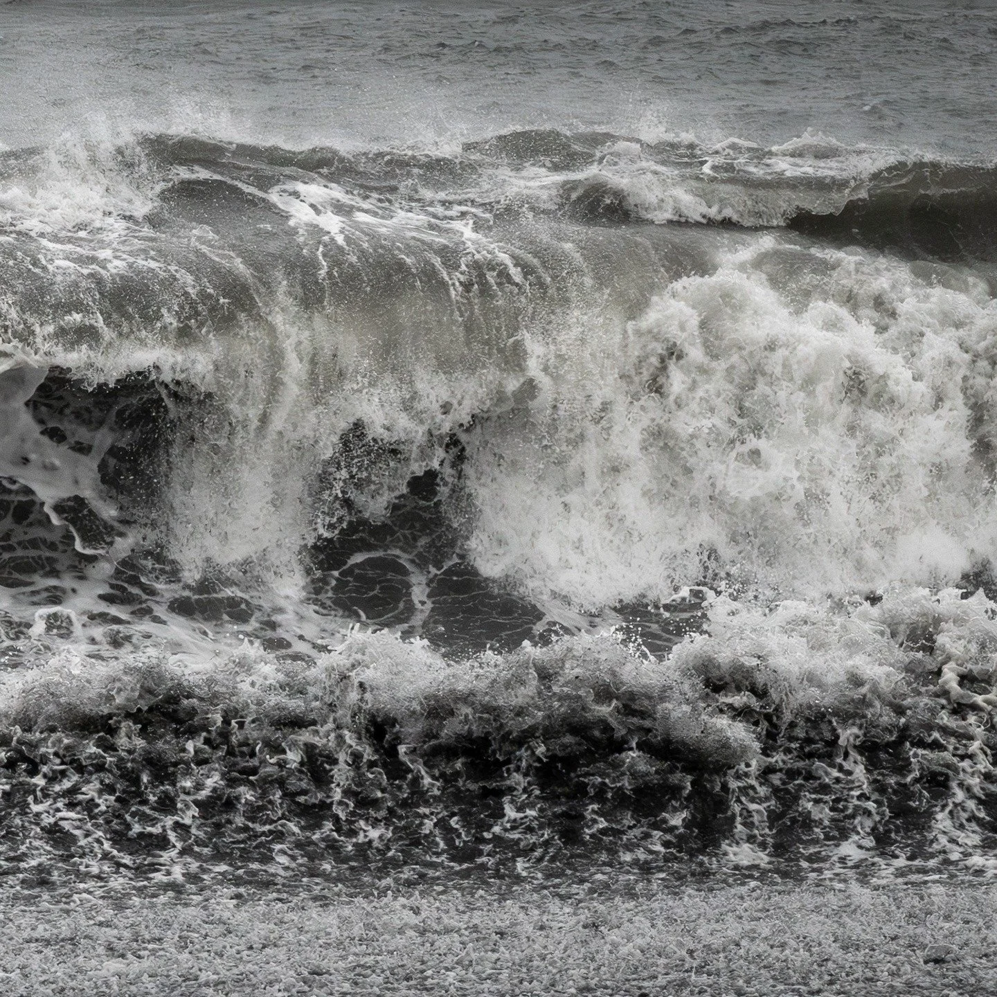 The North Atlantic speaks in thunder here, where waves meet black volcanic sand in an ancient conversation. Reynisfjara is where Iceland reveals its raw soul, a place where the elements perform their eternal dance against basalt columns carved by tim
