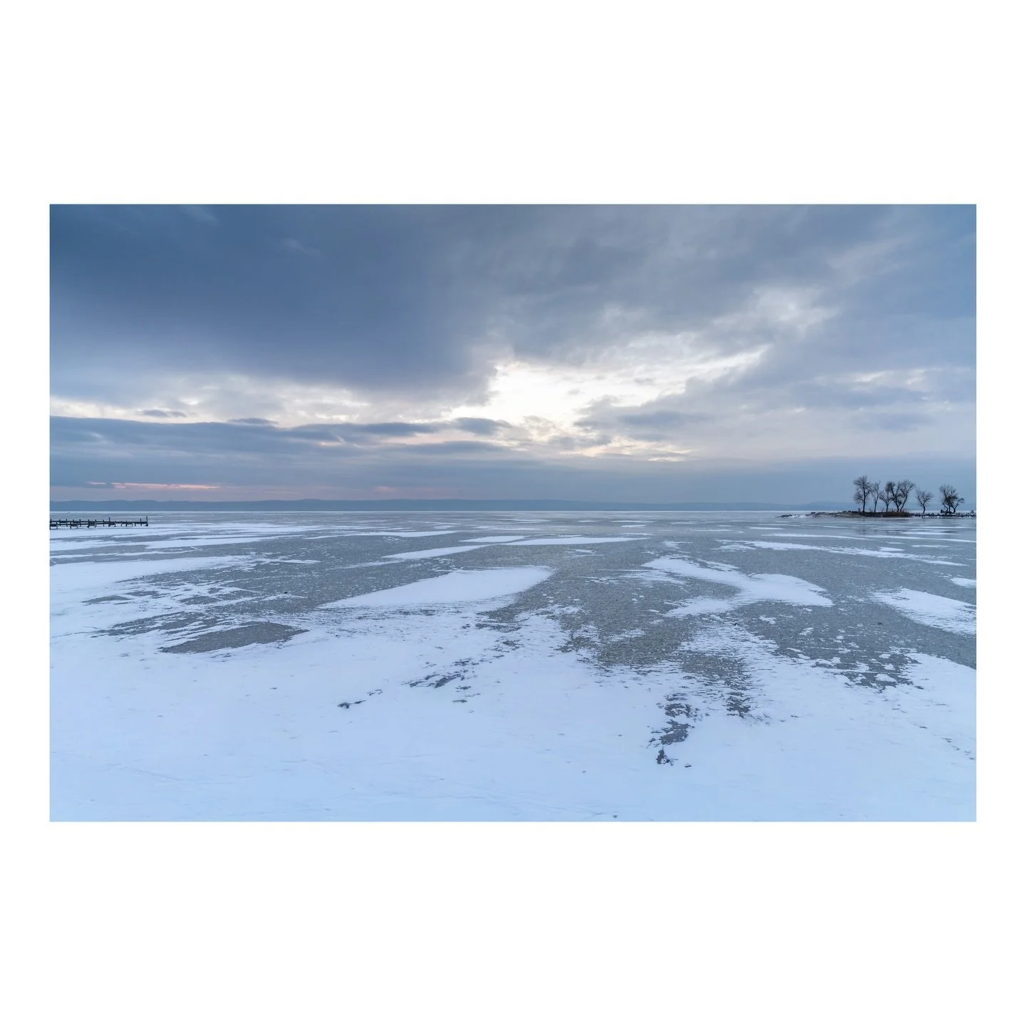 When winter claims the steppe lake, silence transforms into a visual symphony. The frozen expanse of Neusiedlersee becomes an abstract canvas where ice patterns trace stories only the wind remembers, and solitary trees stand as witnesses to the seaso