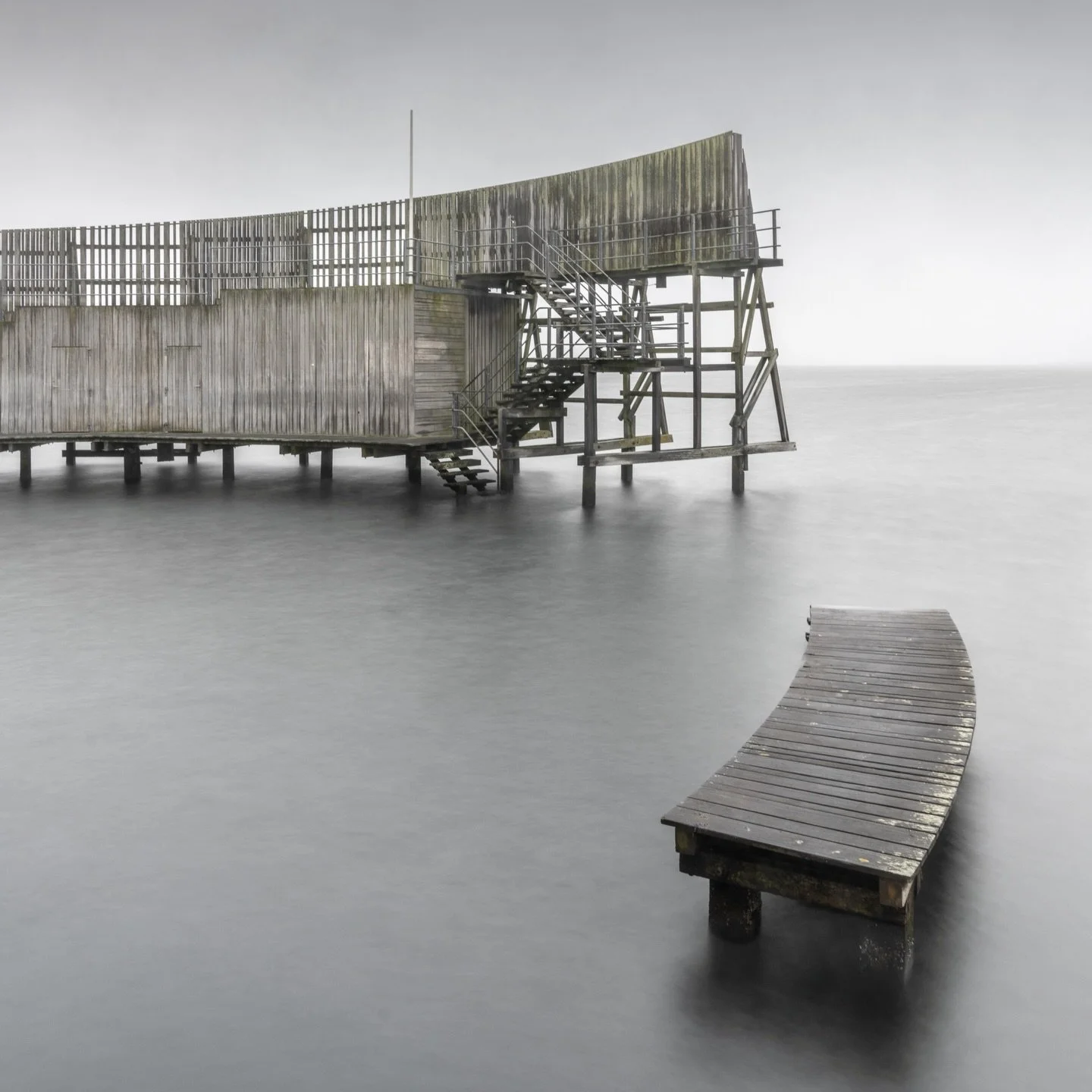 The Kastrup Sea Bath extends 100 meters into the &Oslash;resund. The curved platform creates shelter from wind while offering open water access.
📌 Copenhagen, Denmark
✁&mdash;&mdash;&mdash;&mdash;&mdash;&mdash;&mdash;&mdash;&mdash;&mdash;&mdash;&mda