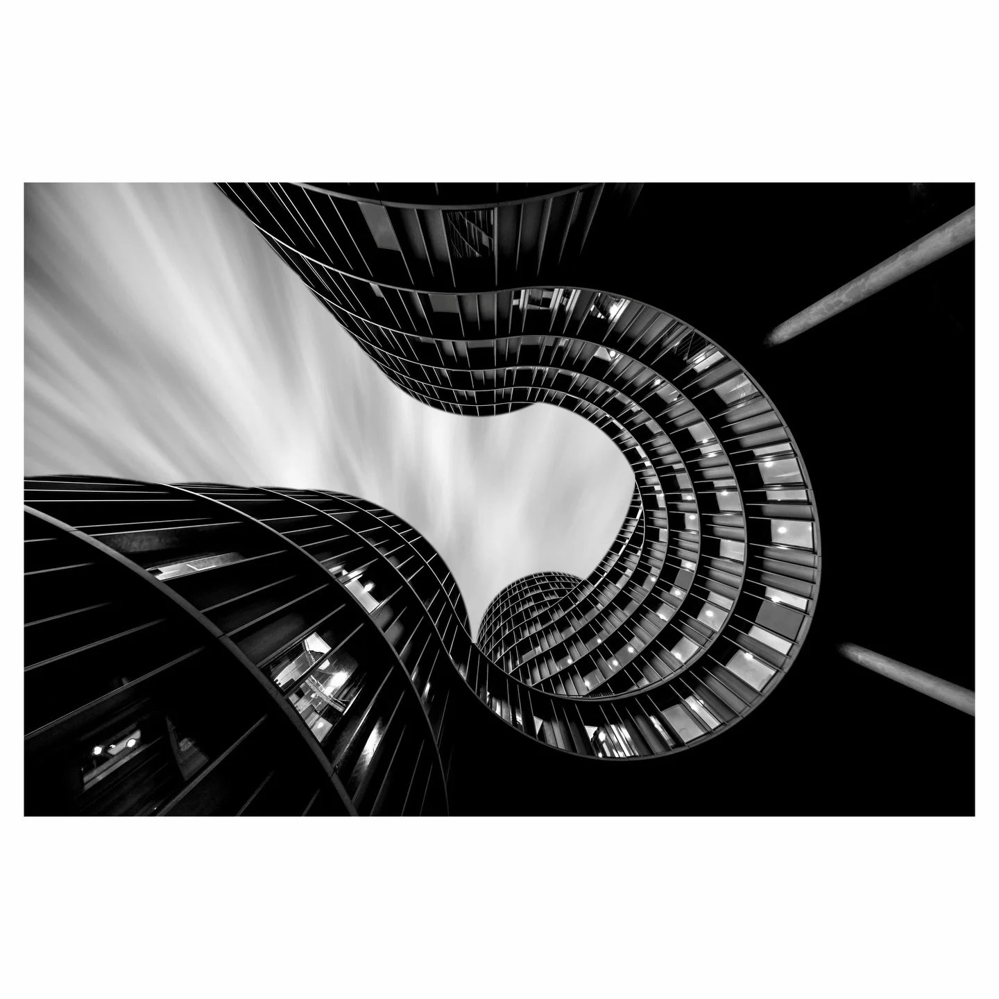 Five copper cylinders spiral into the Copenhagen sky where Axeltorv meets Tivoli. Lundgaard &amp; Tranberg designed Axel Towers without front or back, a building that invites you to orbit it, move through it, look up and lose your sense of direction.