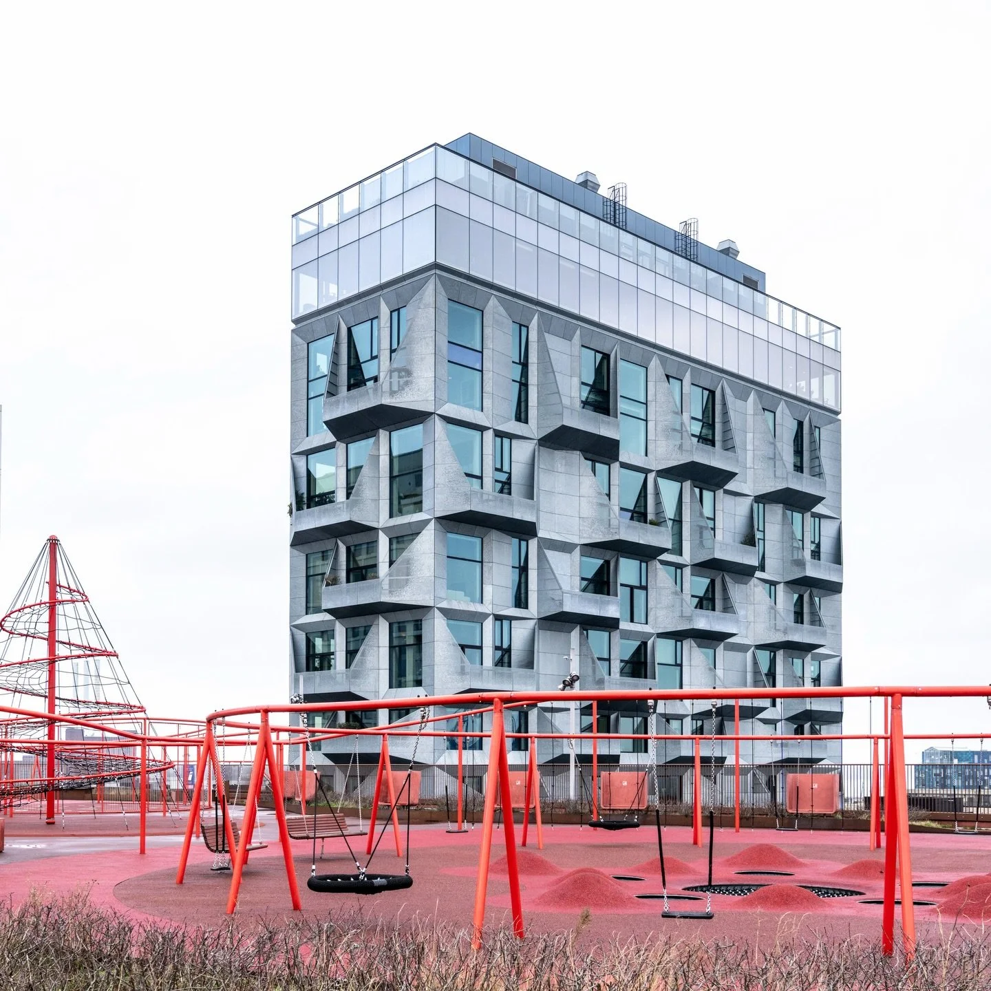Where industrial heritage meets contemporary vision. The Silo in Nordhavn stands as a testament to Copenhagen&rsquo;s ability to reimagine its past, its angular galvanized steel facade folding light and shadow into a geometry that feels alive. A buil