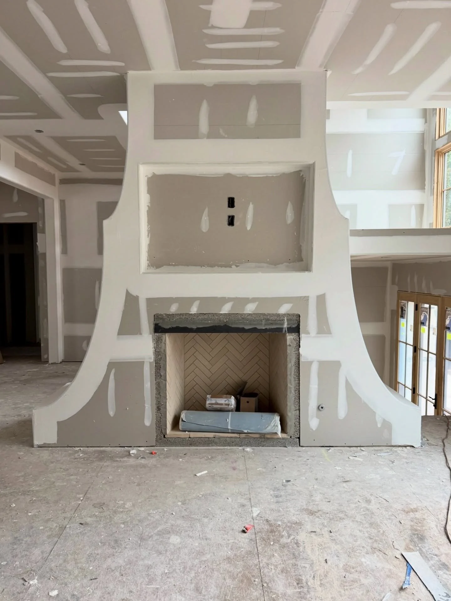 Progress continues at our Chastain Park new build &mdash; sheetrock is up, and the vision is beginning to take shape. A pagoda-style fireplace and soft bullnose corners introduce a touch of craftsmanship that will carry throughout the home.

Cabinetr
