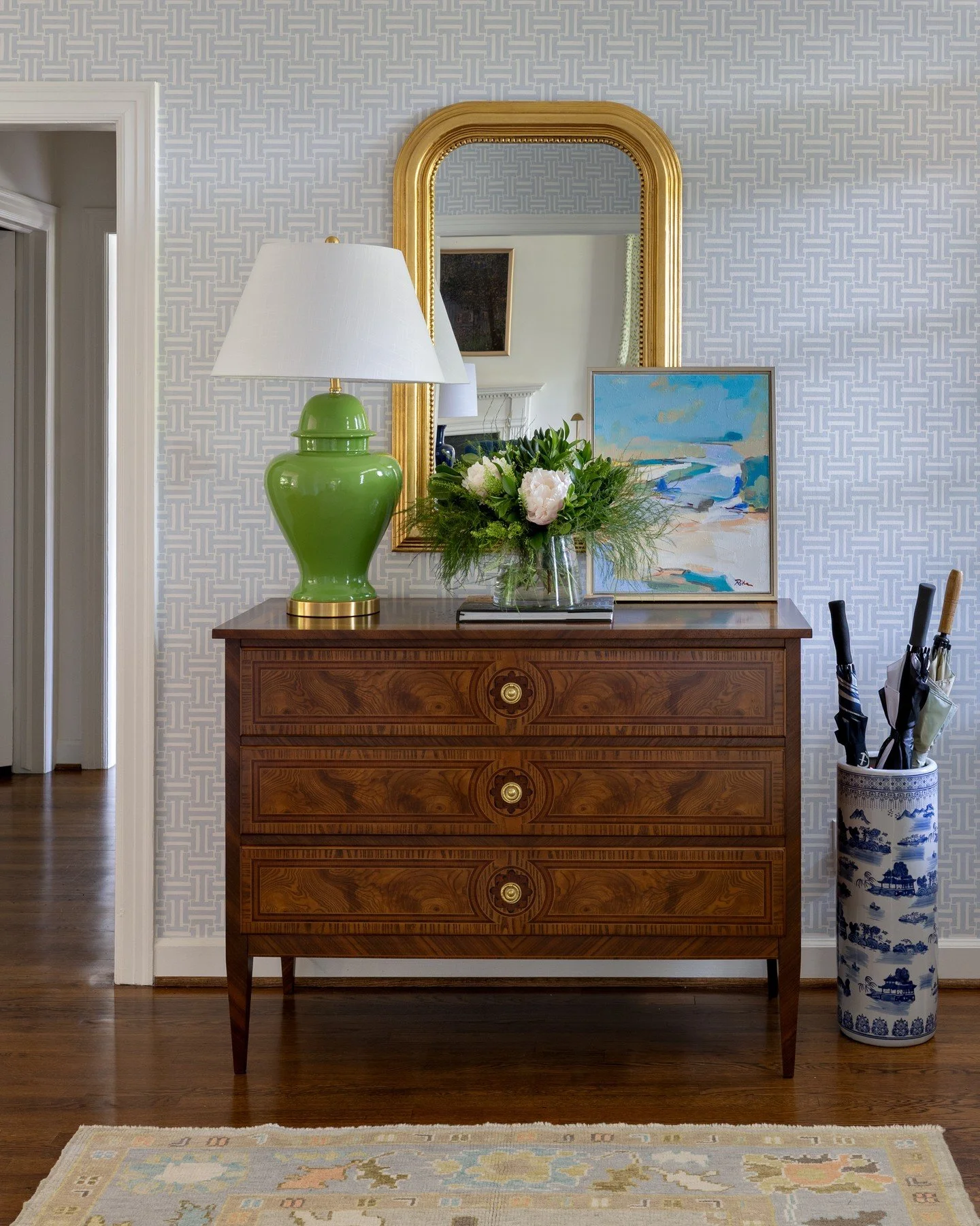 A thoughtfully layered foyer sets the tone for the rest of the home &mdash; graceful antiques, a touch of color, and art that makes you pause for a moment.⁠
⁠
⁠
#HopeAustinInteriors #atlantainteriors #classicdesign #foyergoals #southernstyle #souther