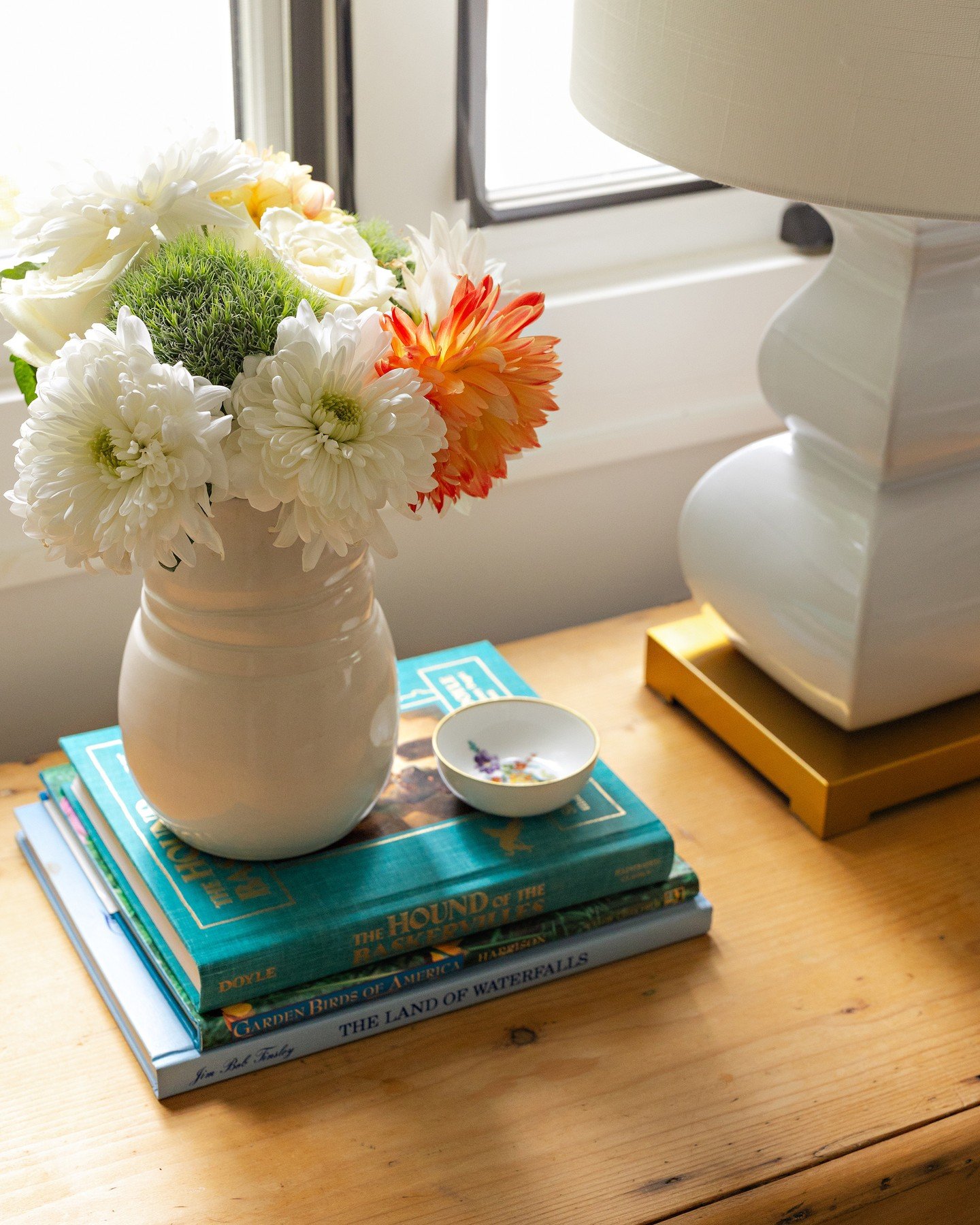 A guest room isn&rsquo;t ready for overnight guests without ...⁠
⁠
✨ A nightstand ready for visitors... add a sweet floral arrangement or fresh greenery, an interesting book, and include a small bowl or dish as a catchall for jewelry.⁠
✨Proper draper