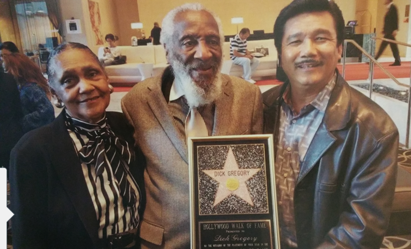 Lilian & Dick Gregory, comedian and activist. enjoying a private chat after his Hollywood Walk of Fame ceremony.