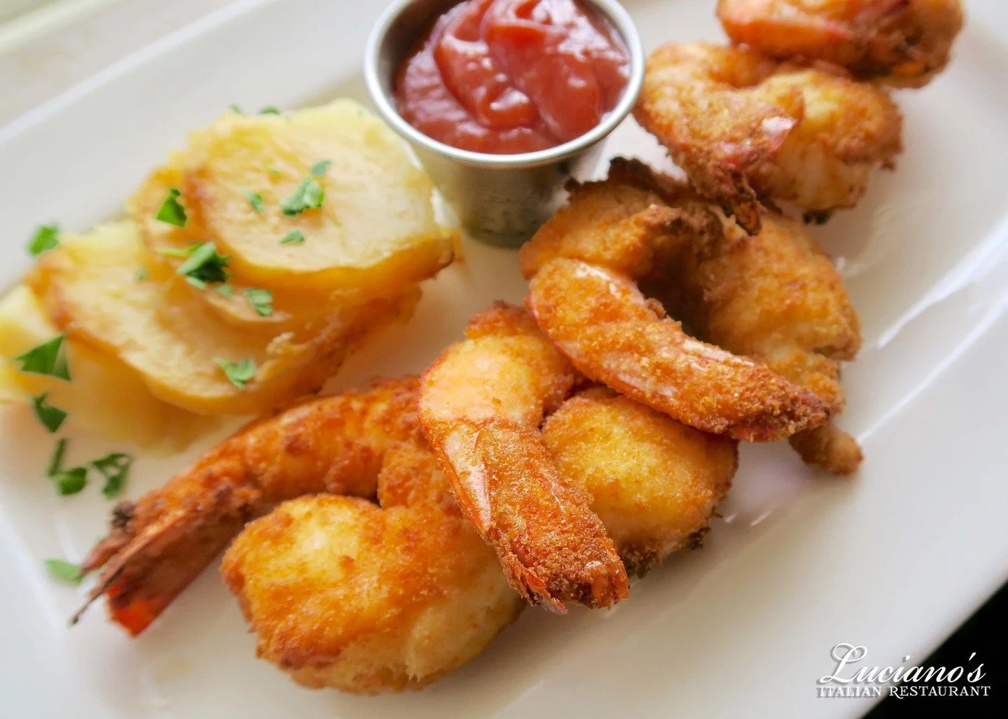 Enjoy our Jumbo Fried Shrimp - Breaded and served with our signature cocktail sauce. Delicious!