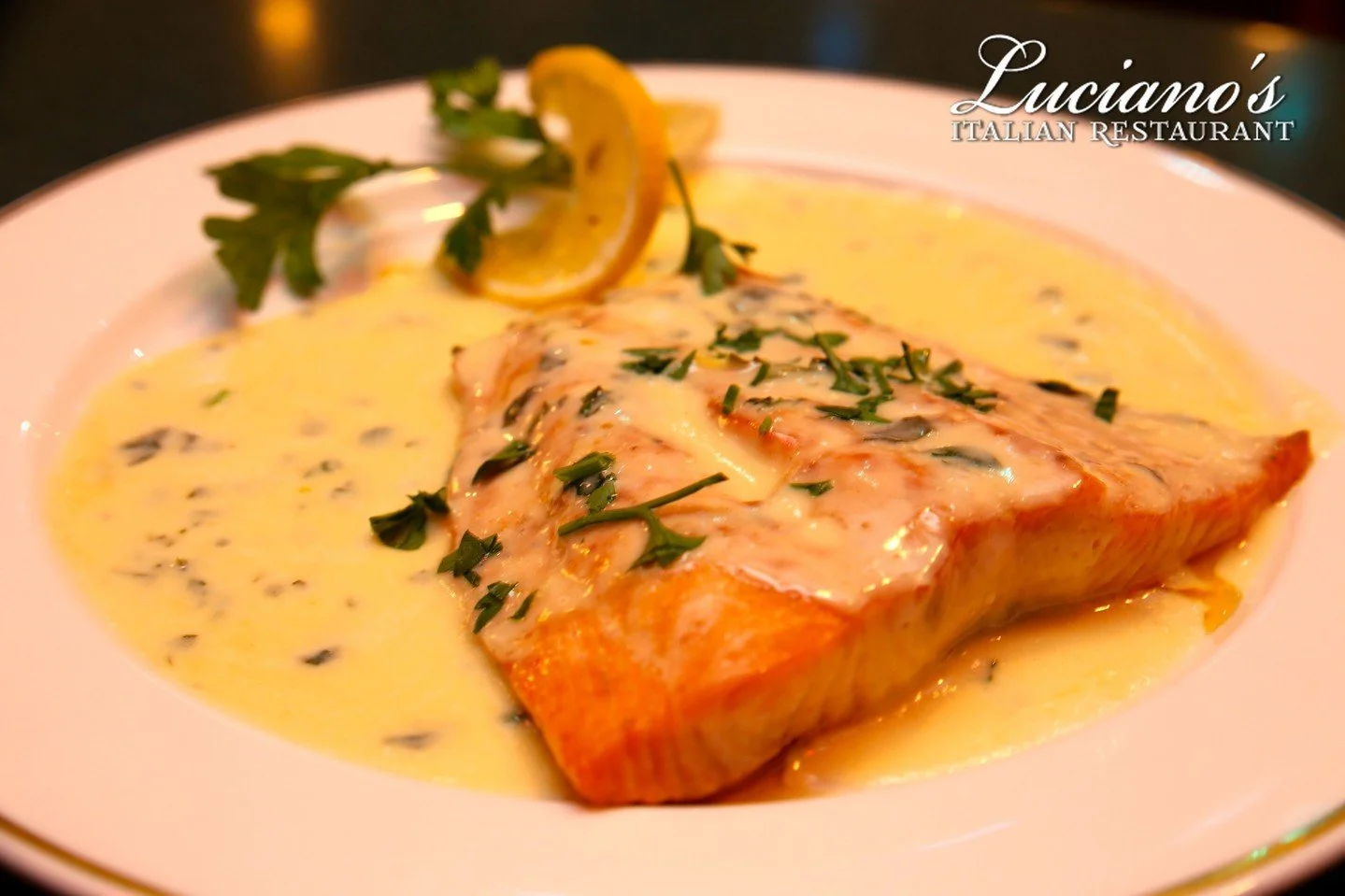 Fall in love with our Salmon Toscana! Broiled with light Italian seasoning and laced with a lemon cream sauce!