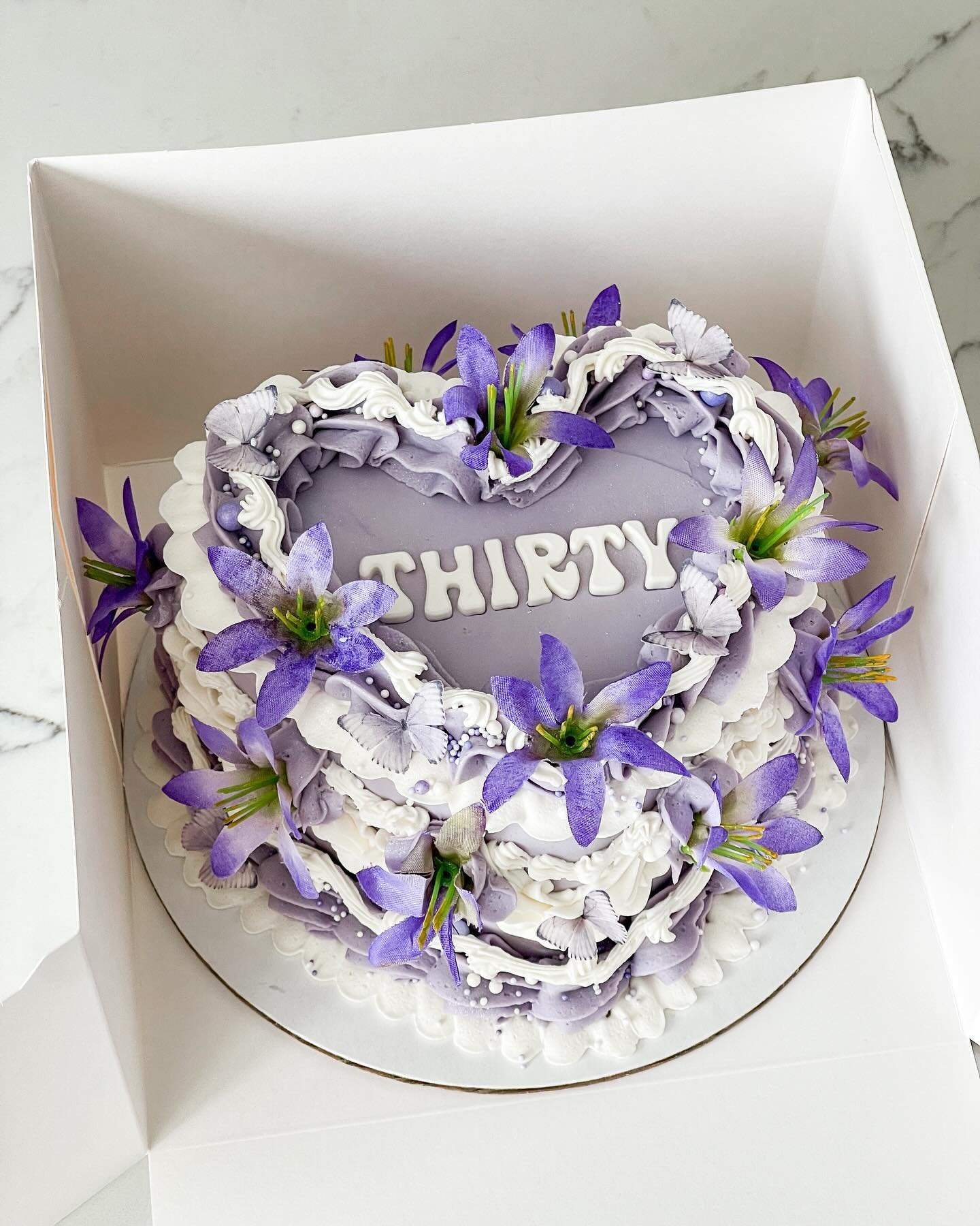 lavender heart cake 🪻💜

6&rdquo; two layer heart cake with lavender &amp; white buttercream, white chocolate letters, faux flowers, sprinkles &amp; edible glitter ✨

#heartcake #purplecake #birthday #baker