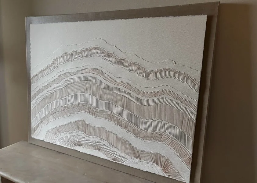 &lsquo;Threads of Resilience&rsquo;
A cross section of tree rings stitched in copper, gold and pearl. Now hanging at Art By Design benefiting @artsmemphis 🤍 
30x40 on Coldpress 156lb @archespapers 

#artbydesignmemphis #catlenckewatercolor #paperart