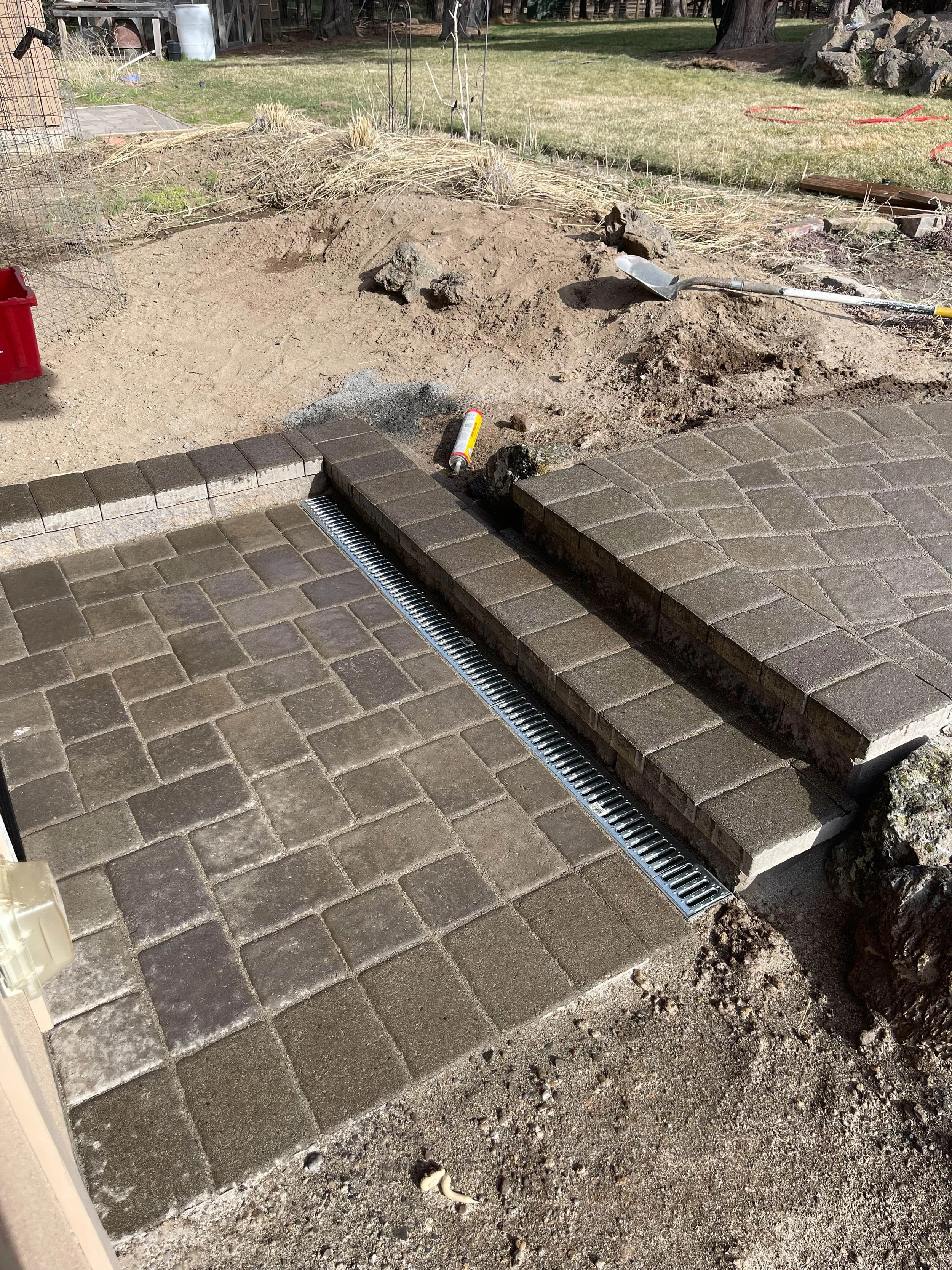 Paver stairs connecting upper and lower patio, Central Oregon