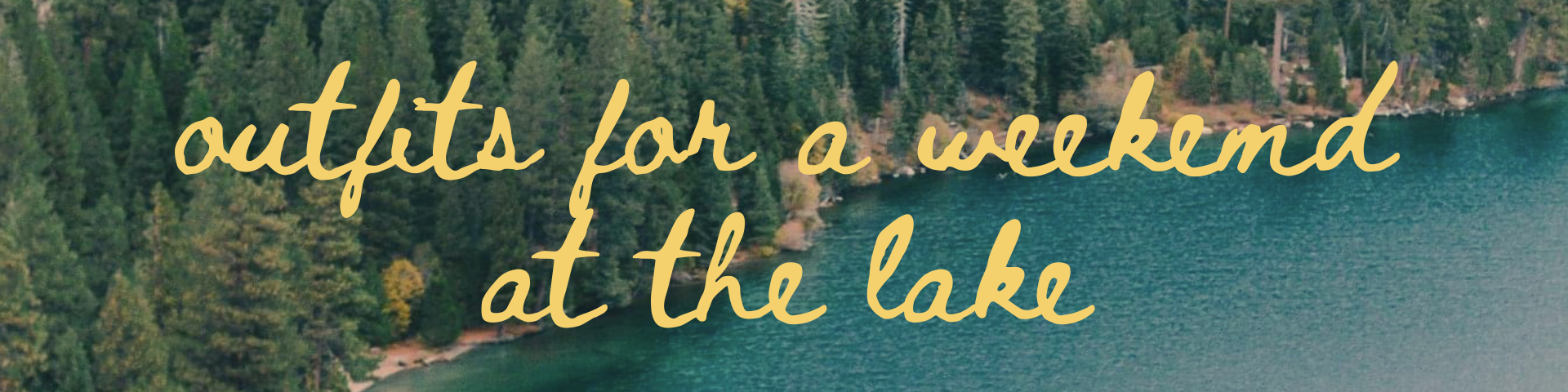 A peaceful lakeside scene with a dense forest of pine trees surrounding a large, calm lake with blue-green water.