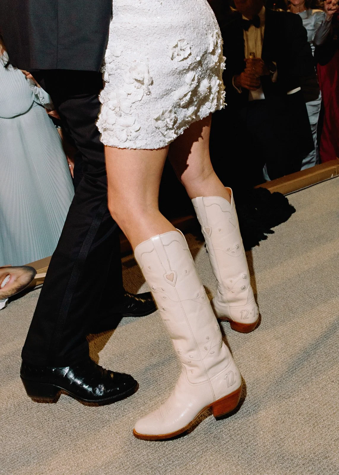 holiday-wedding-bride-cowboy-boots-reception-detail.jpg
