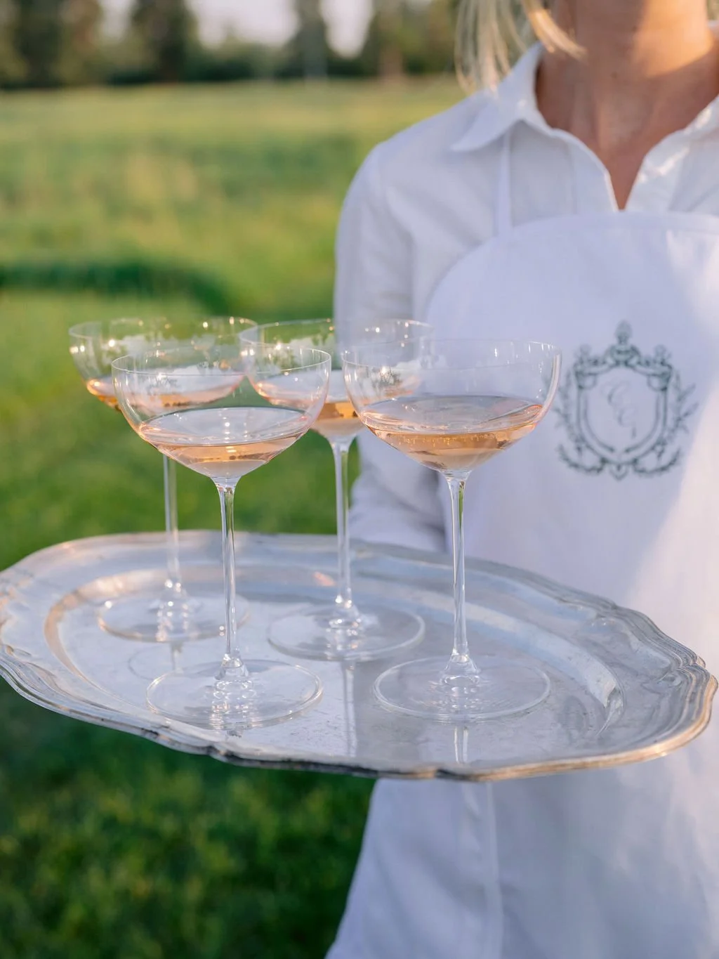 laurie-arons-special-events-montana-family-estate-wedding-rose-coupes-silver-tray-monogrammed-apron-meadow-welcome-toast-private-ranch.jpg
