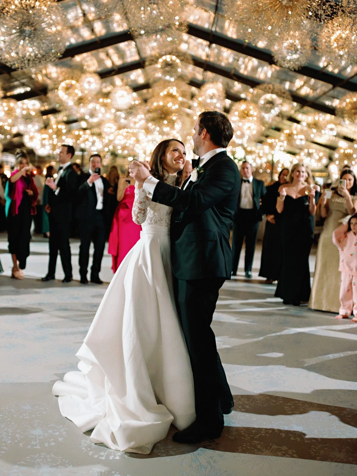 tented-wedding-bride-groom-first-dance-chandeliers.jpg
