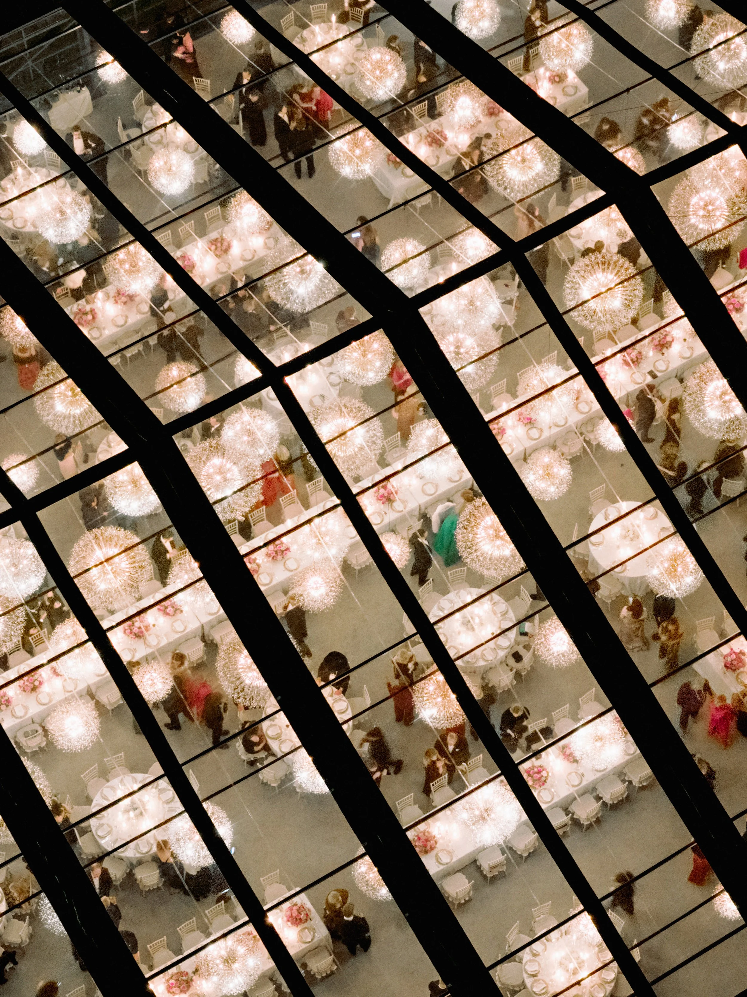 tented-wedding-aerial-glass-roof-starburst-chandeliers.jpg