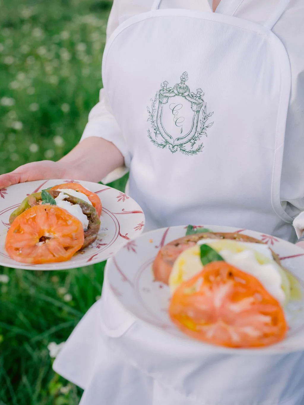 laurie-arons-special-events-montana-family-estate-wedding-heirloom-tomato-burrata-monogrammed-crest-apron-farm-to-table-private-ranch-wedding.jpg