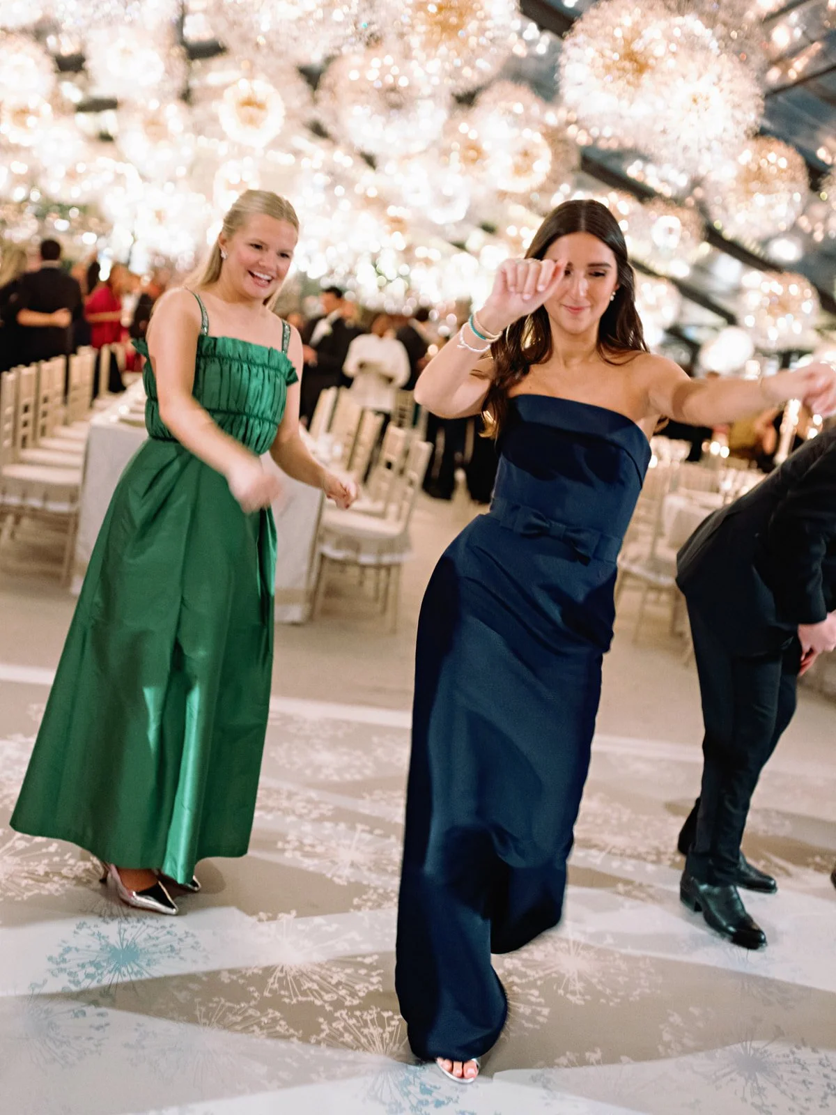 luxury-home-wedding-texas-bridesmaids-dancing-chandeliers.jpg